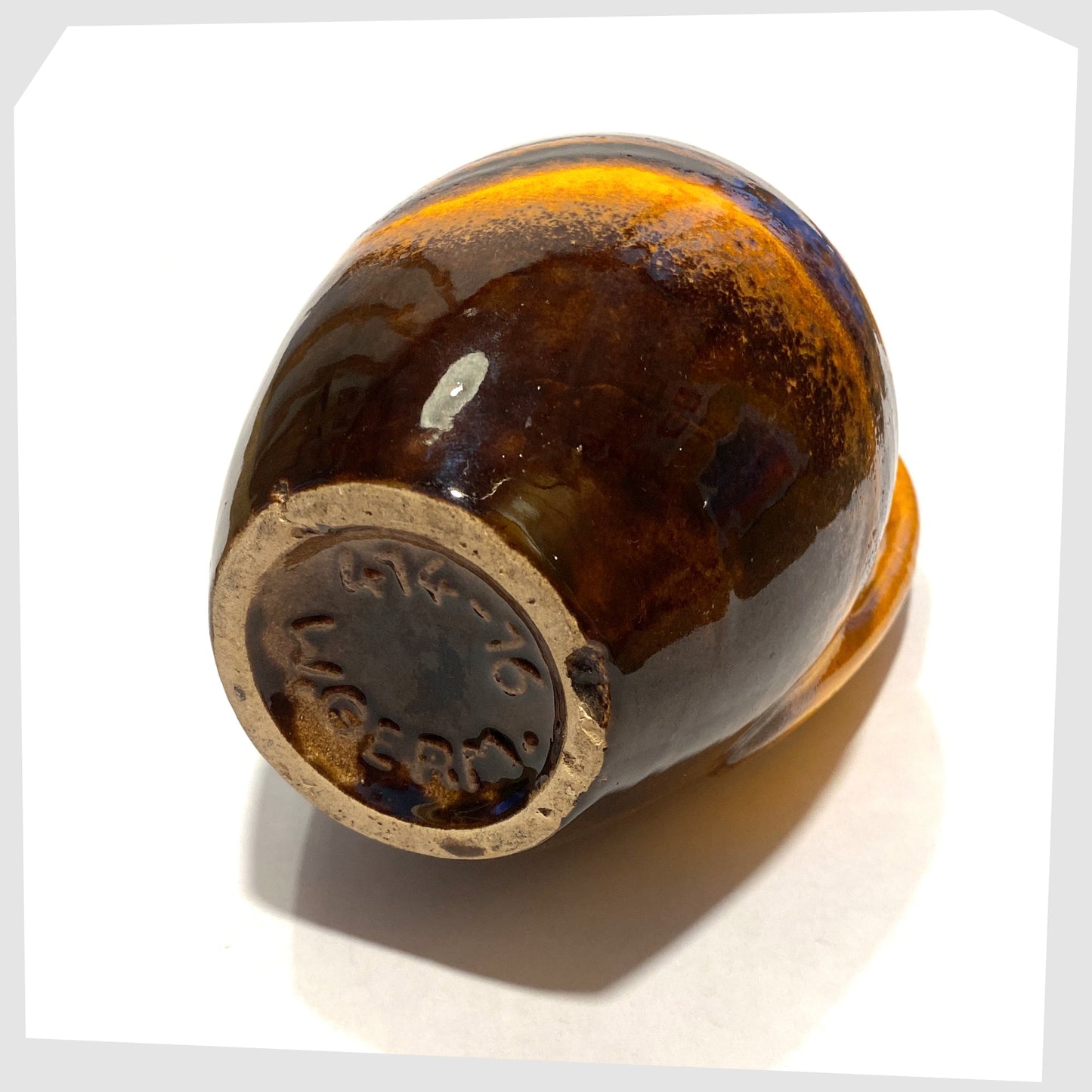 base of the Scheurich Keramik 414-16 Vase in a vibrant orange and chestnut brown glaze