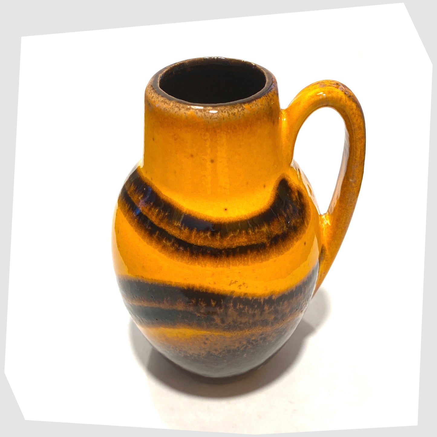 top rim of the Scheurich Keramik 414-16 Vase in a vibrant orange and chestnut brown glaze