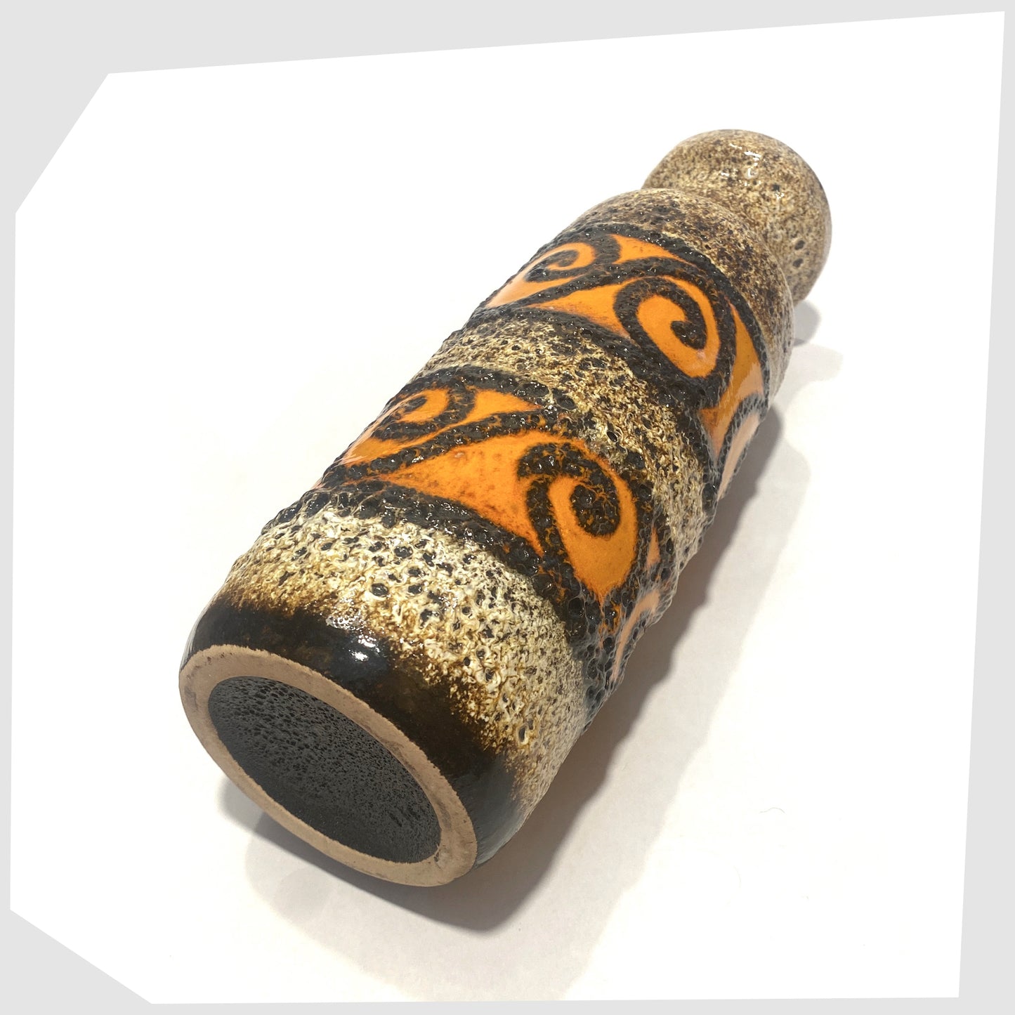 base of the Scheurich Keramik 200-28 Vase with bands of orange and black swirls frames in deep fat lava glaze