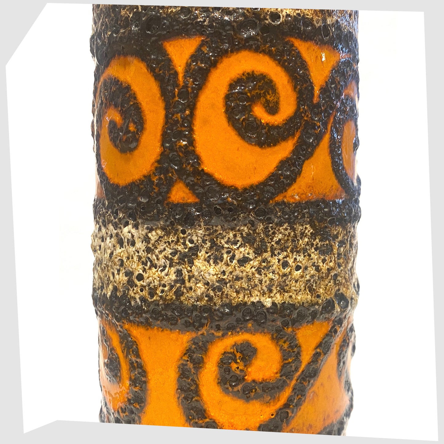 close up of the Scheurich Keramik 200-28 Vase with bands of orange and black swirls frames in deep fat lava glaze