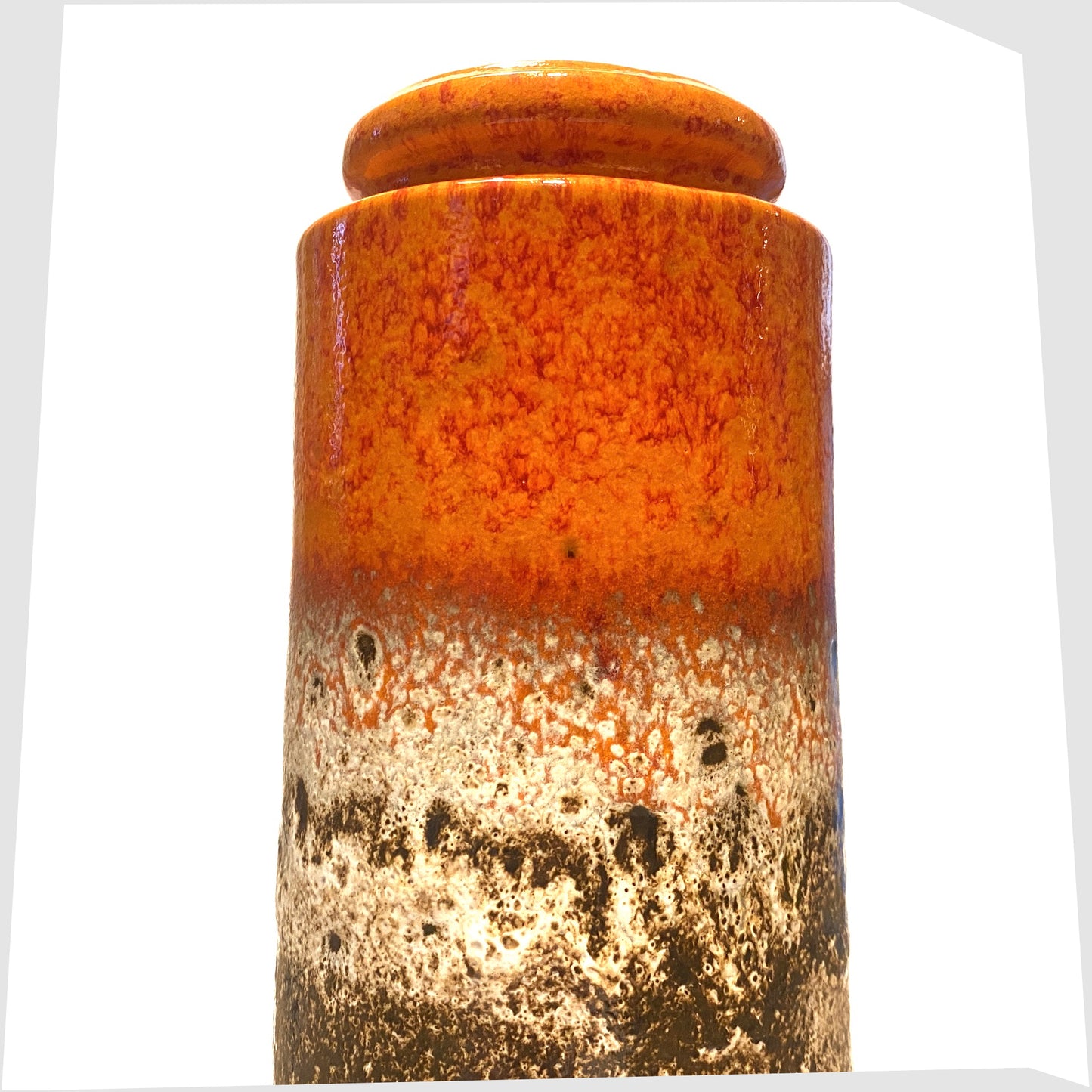 close up of the scheurich keramik 206-26 vase finished in a fat lava glaze with a bold volcanic orange top