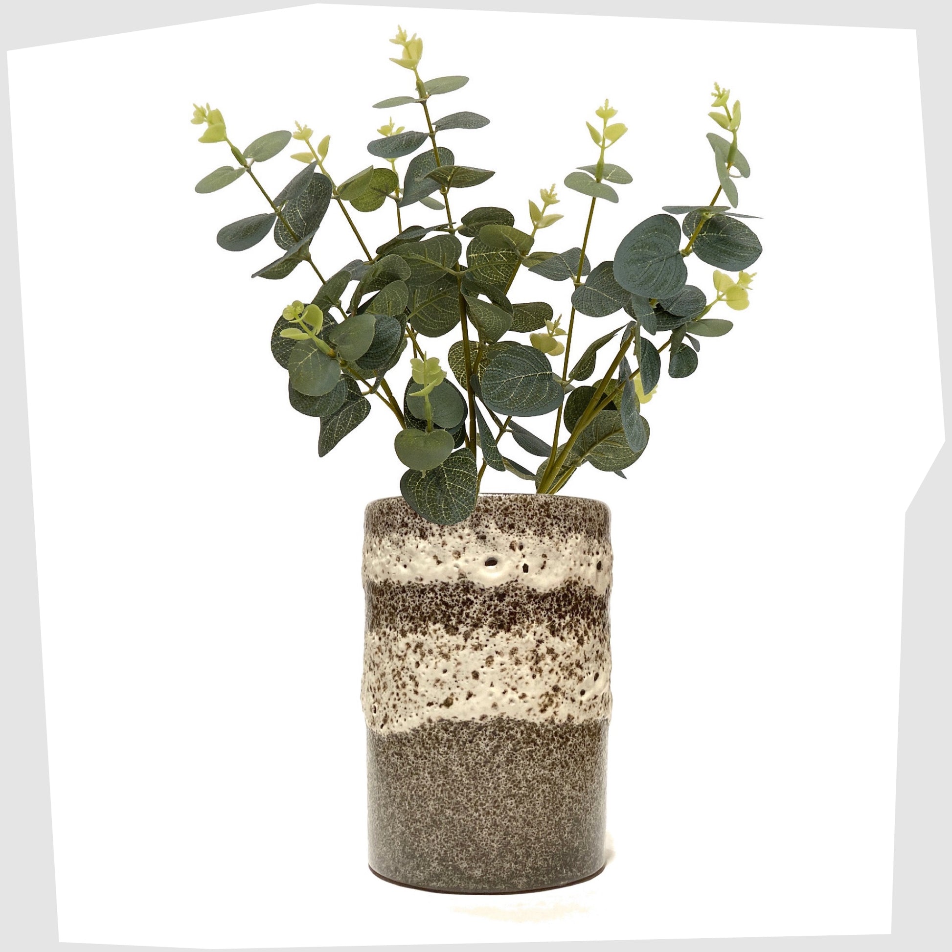 West German Pottery cylindrical vase with bands of grey and white fat lava, shown with a eucalyptus plant