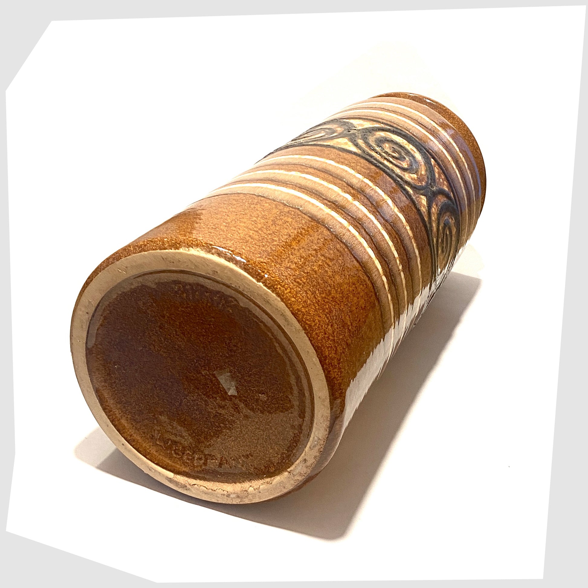 base of the large Scheurich Keramik 217-42 floor vase in a honey and chestnut striped glaze with a central band of swirling at lava