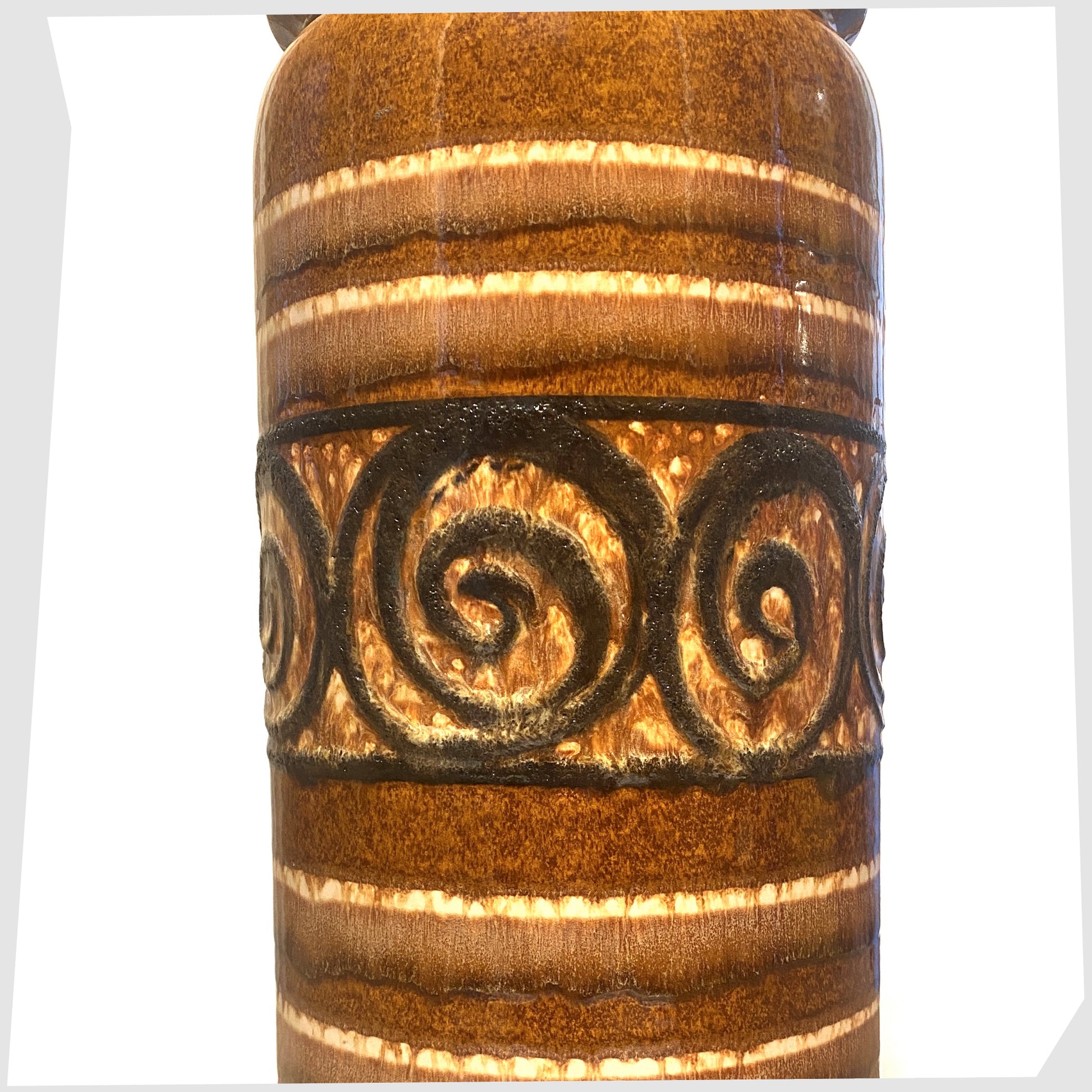 close up of the Scheurich Keramik 217-42 floor vase in a honey and chestnut striped glaze with a central band of swirling at lava