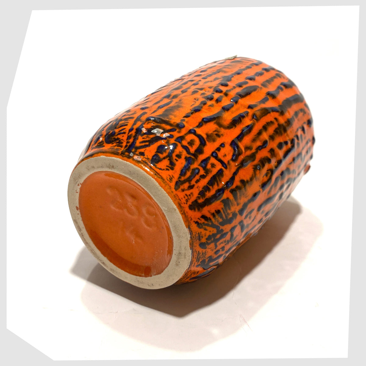 Base of the Scheurich Keramik 238-14 Vase, part of Scheurich's 'Europ Linie' collection, in a vivid orange and blue fat lava glaze, shown on a white background