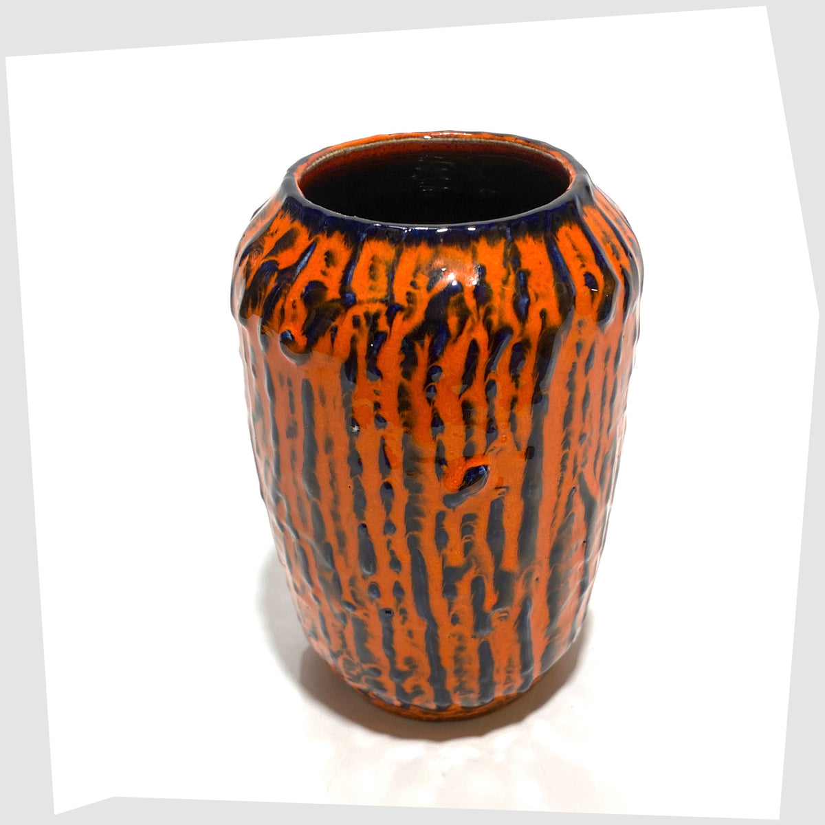 Top rim of the Scheurich Keramik 238-14 Vase, part of Scheurich's 'Europ Linie' collection, in a vivid orange and blue fat lava glaze, shown on a white background