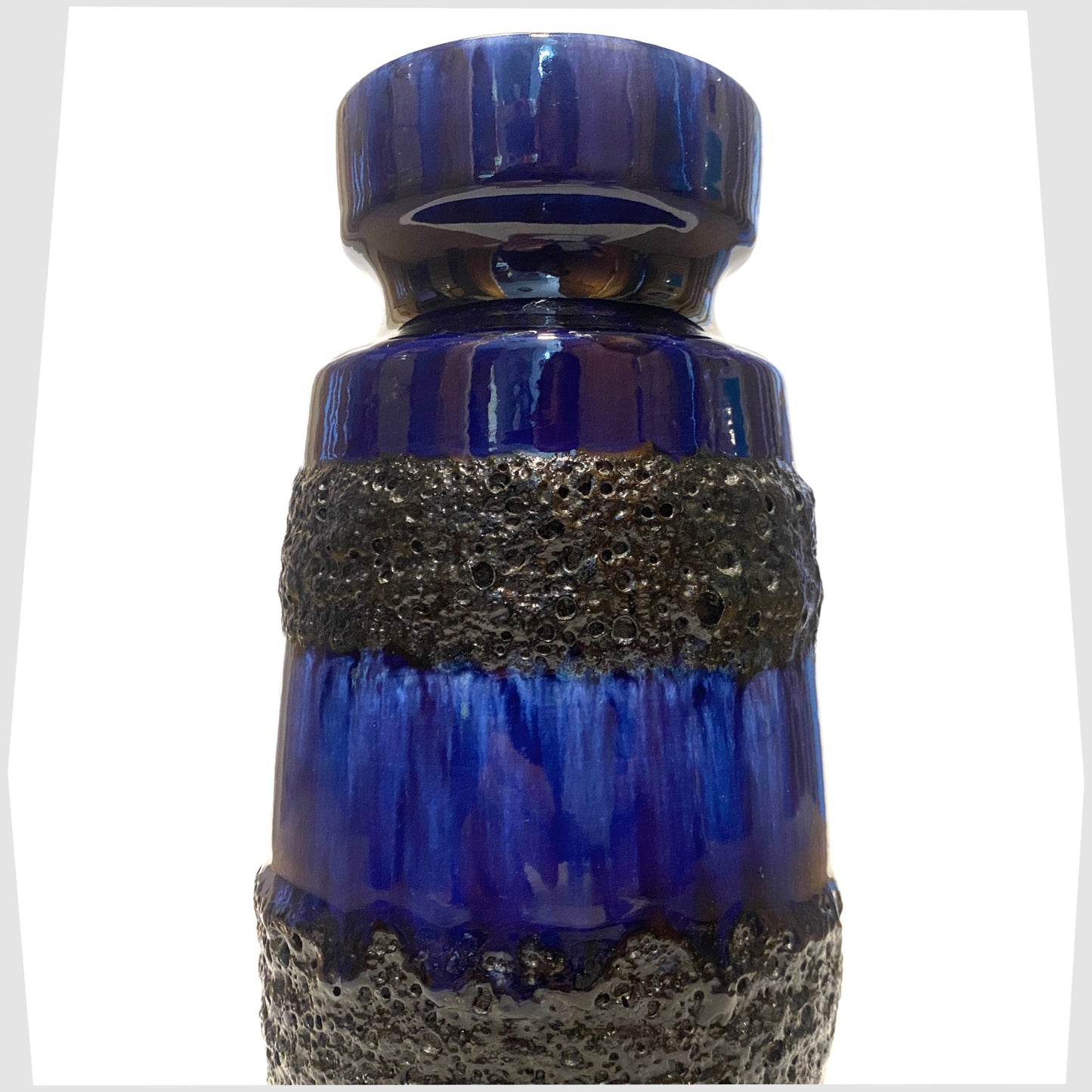 close up of the Scheurich Keramik 242-22 Vase in a rich blue glaze with bands of black fat lava