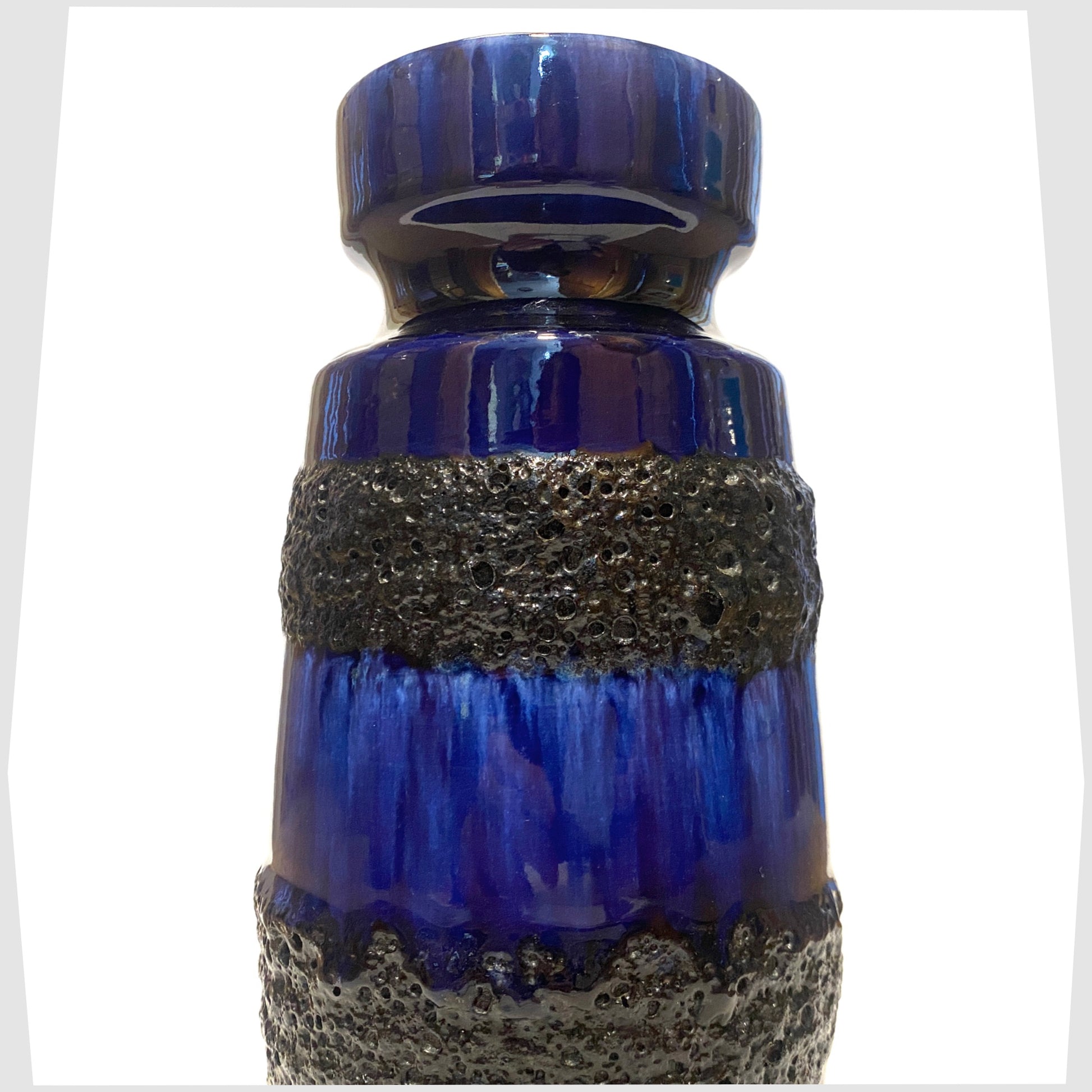 close up of the Scheurich Keramik 242-22 Vase in a rich blue glaze with bands of black fat lava