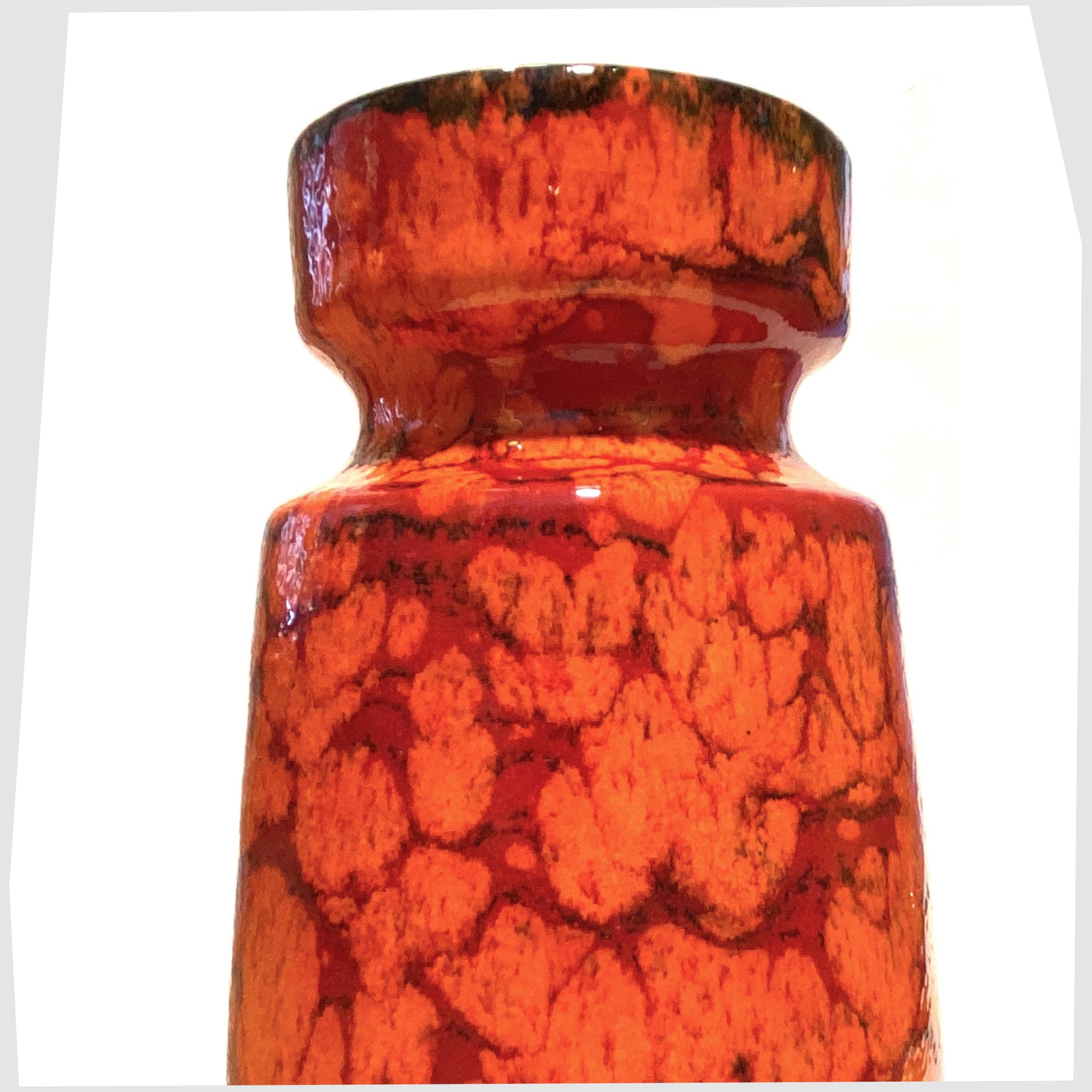 Close up of the Scheurich Keramik 242-22 Vase in a Fire glaze of orange and red 