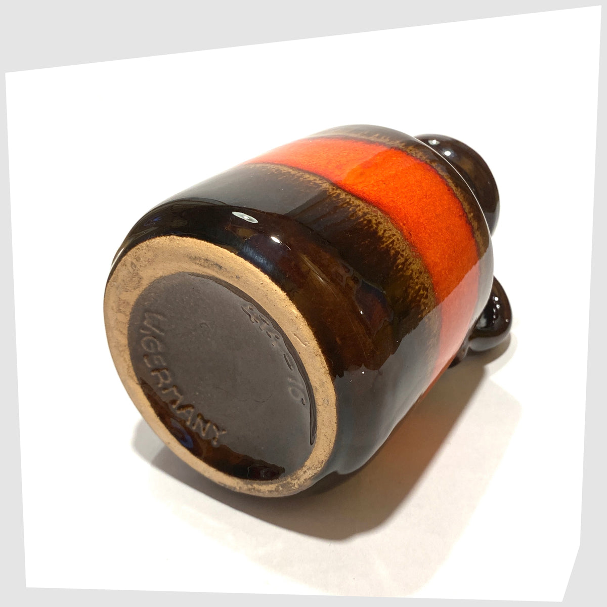 Base of the Scheurich Keramik 414-16 Vase in chestnut brown glaze with a central band of volcanic red, shown on a white background