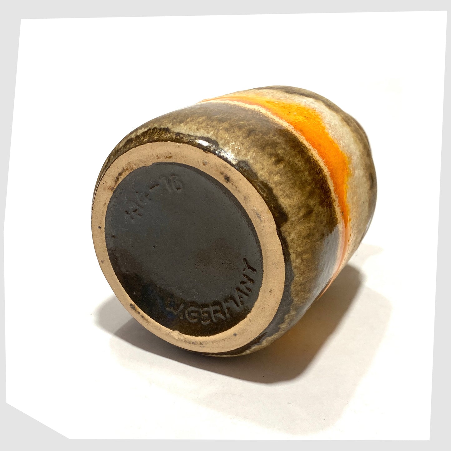Base of the Scheurich Keramik 414-16 Vase in matte fat lava drip glaze with contrasting band of vibrant orange gloss glaze, shown on a white background