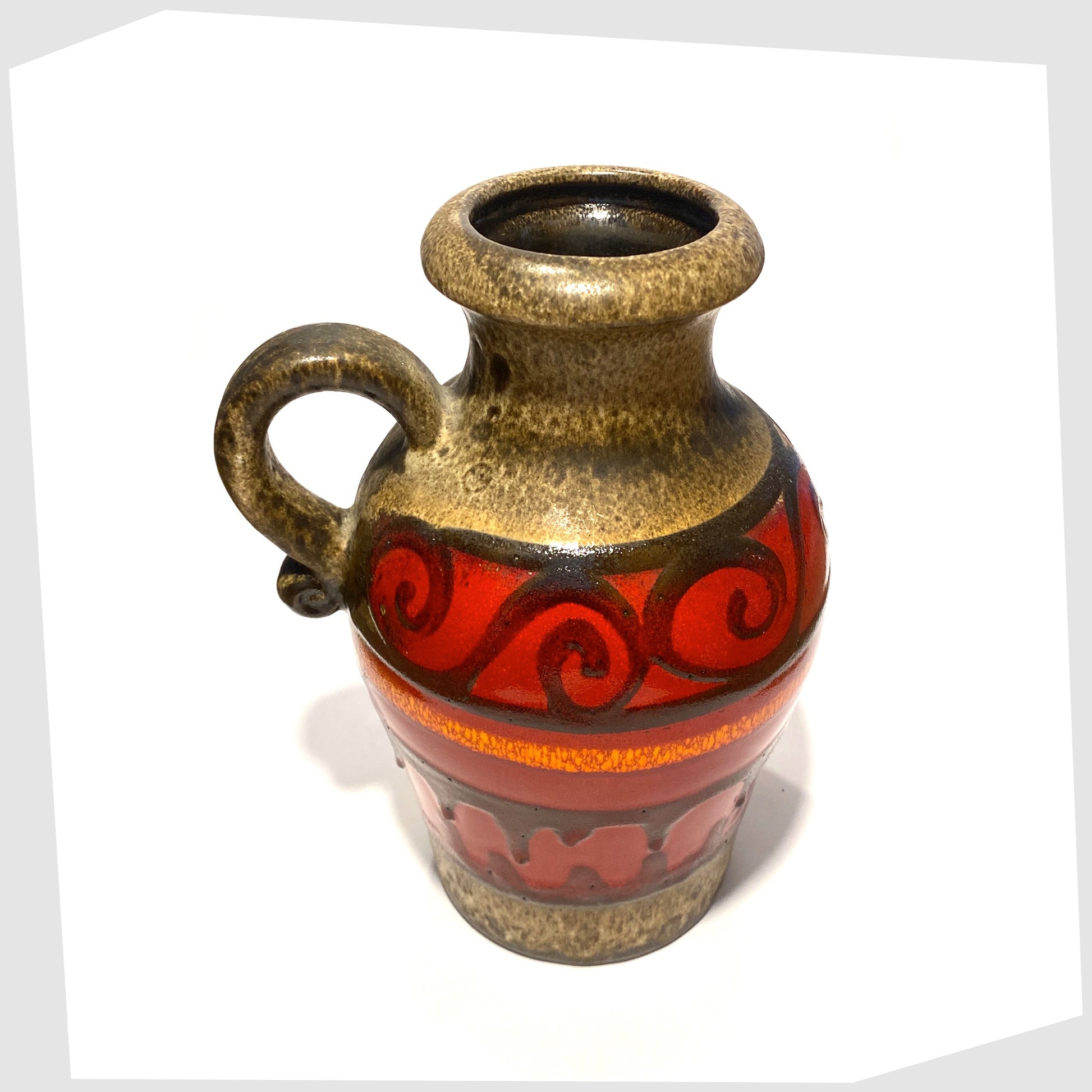top rim of the scheurich keramik 490-25 vase, glazed in volcanic red with swirls and flowing lines of black fat lava