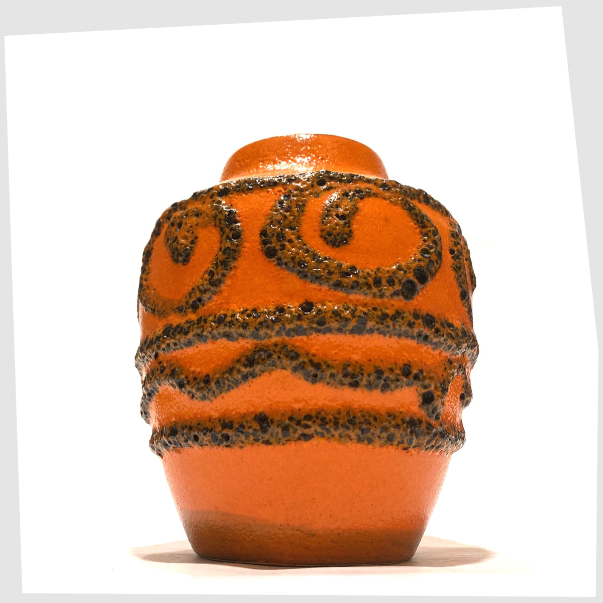 1970s Scheurich Keramik 550-10 Vase in vibrant orange glaze with deep fat lava swirls and flowing lines, shown on a white background