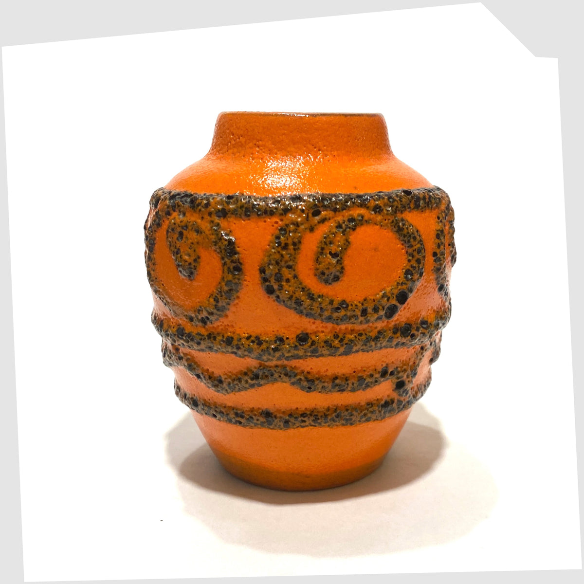 West German Pottery Scheurich Keramik 550-10 Vase in vibrant orange glaze with deep fat lava swirls and flowing lines, shown on a white background