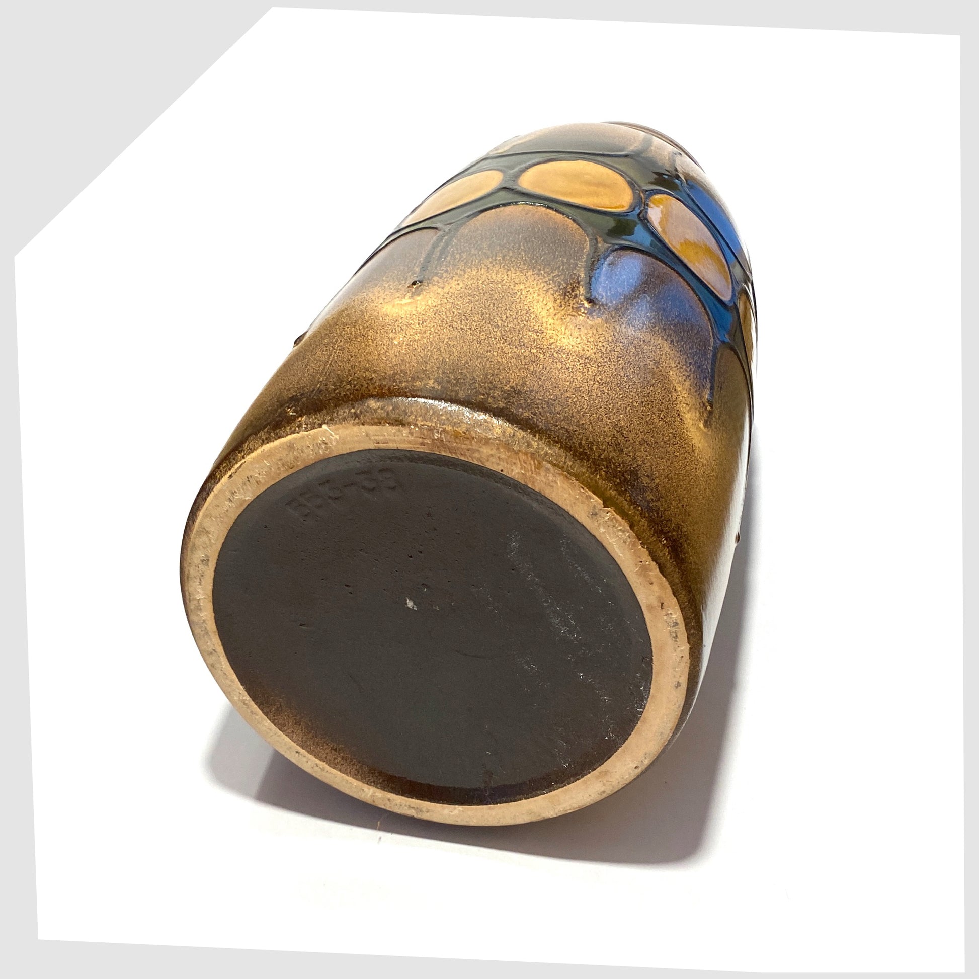 base of the scheurich keramik floor vase, model 553-38, glazed with a bold band of forest  green with amber circles