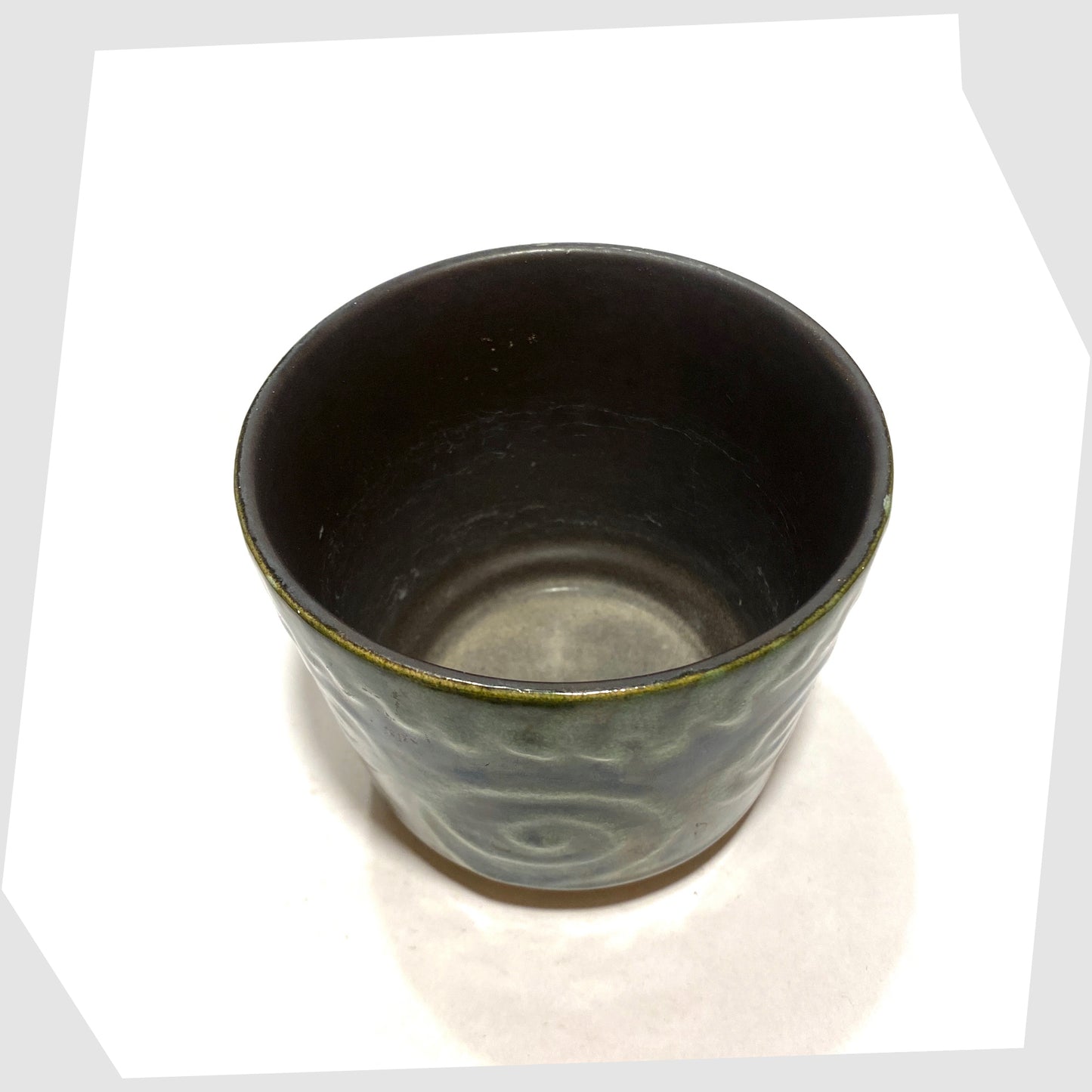 Inside of the Scheurich Keramik 806-12 Planter in green swirled glaze, shown on a white background