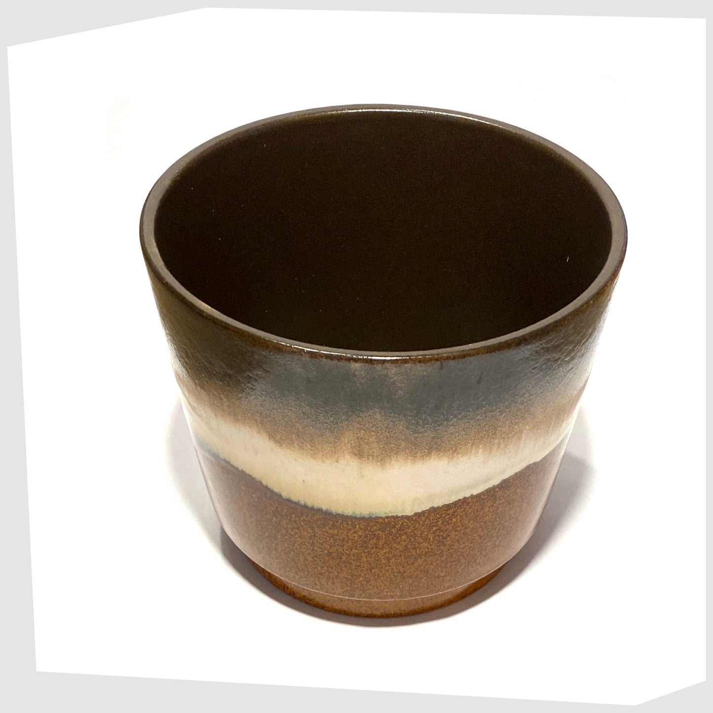 inner glaze on the Large West German Pottery Planter by Scheurich Keramik model 806-19 in a striped glaze of warm grey, brown and cream