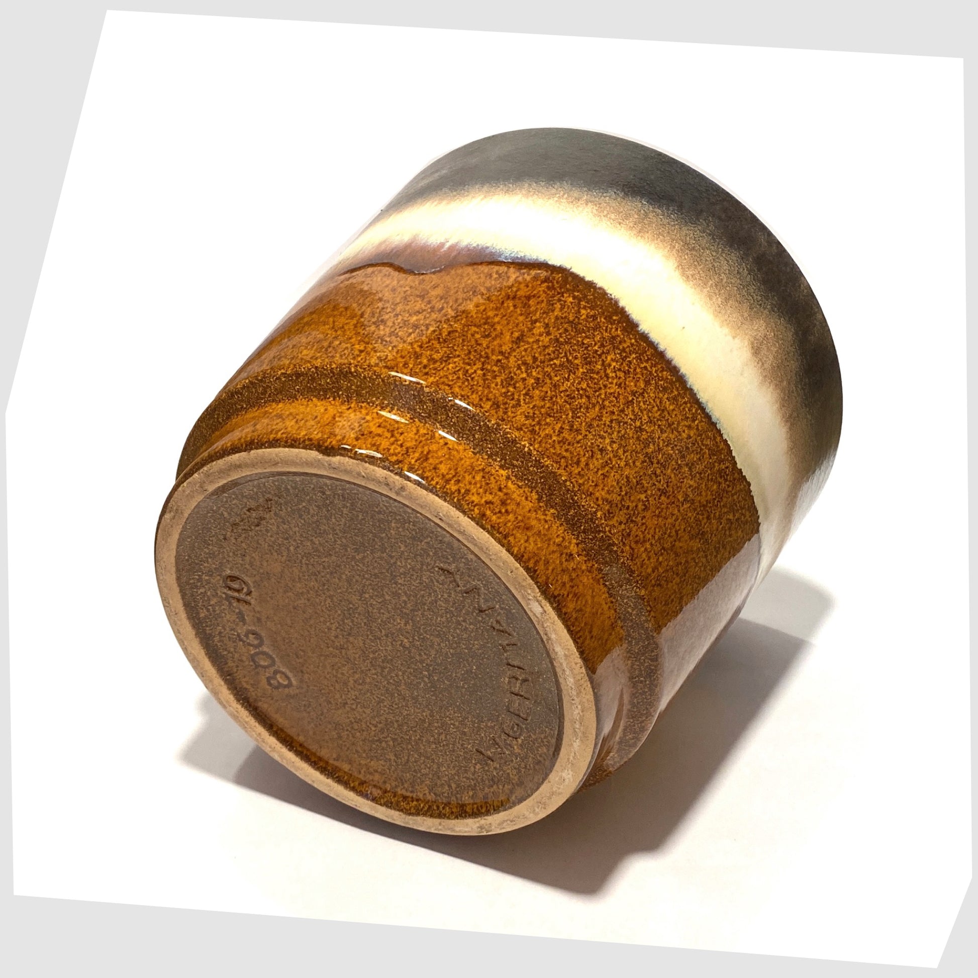 base of the Large West German Pottery Planter by Scheurich Keramik model 806-19 in a striped glaze of warm grey, brown and cream