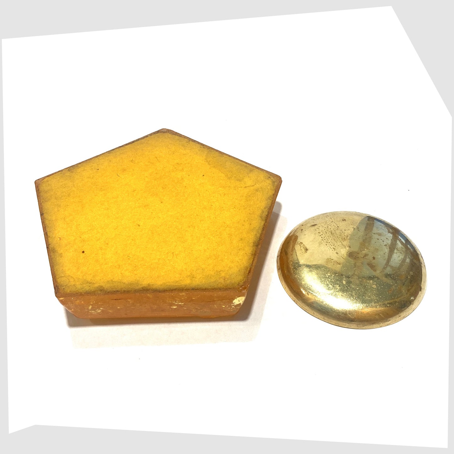 felted base of the Shattaline Ashtray in Orange resin with a brass inlayed dish