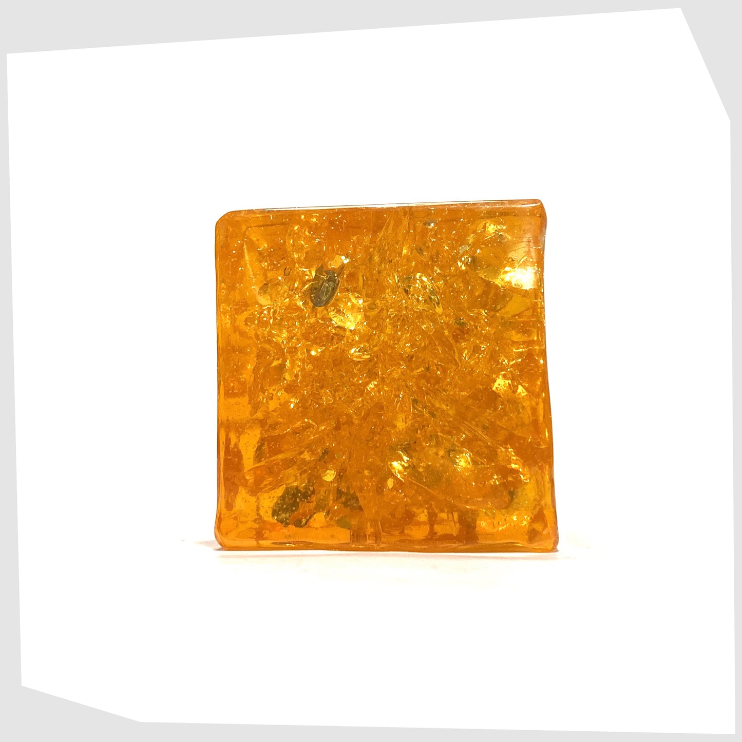 Original Shattaline Cube Paperweight in vibrant orange resin