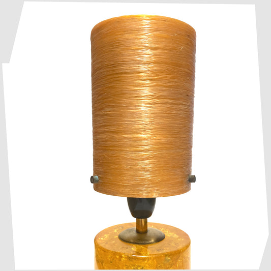 original spun fibreglass lampshade in light orange, shown on an orange shattaline lamp base