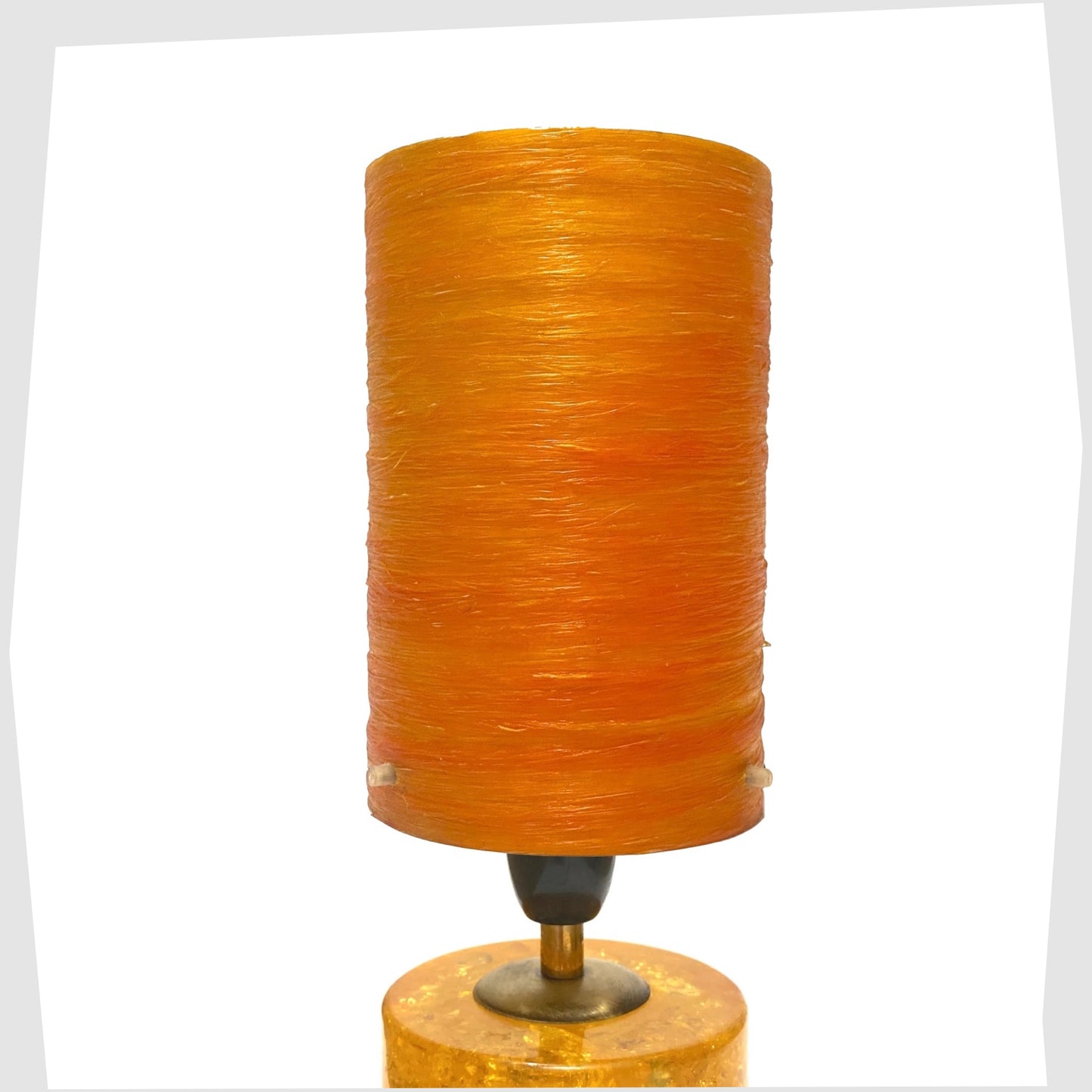 Shattaline Spun Fibreglass Lampshade in Orange, shown on an orange resin lamp base 