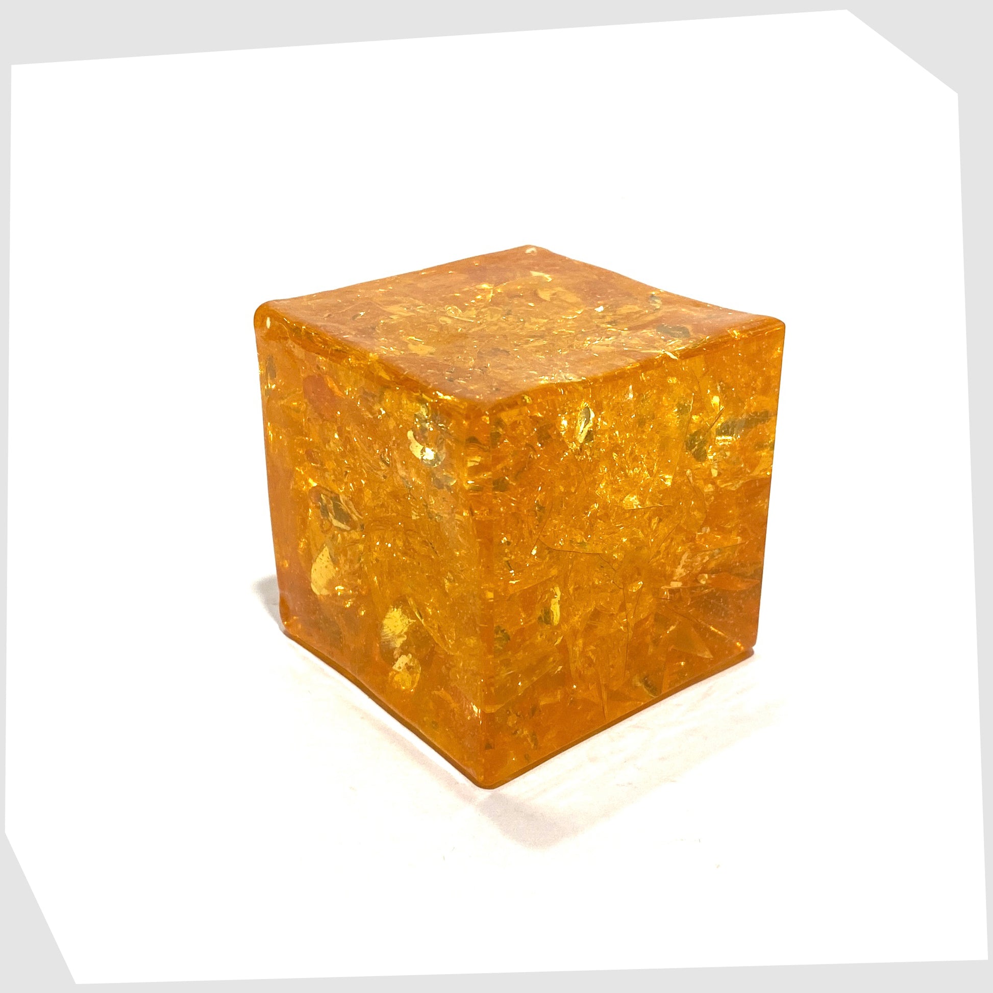 Shattaline Cube Paperweight in vibrant orange resin