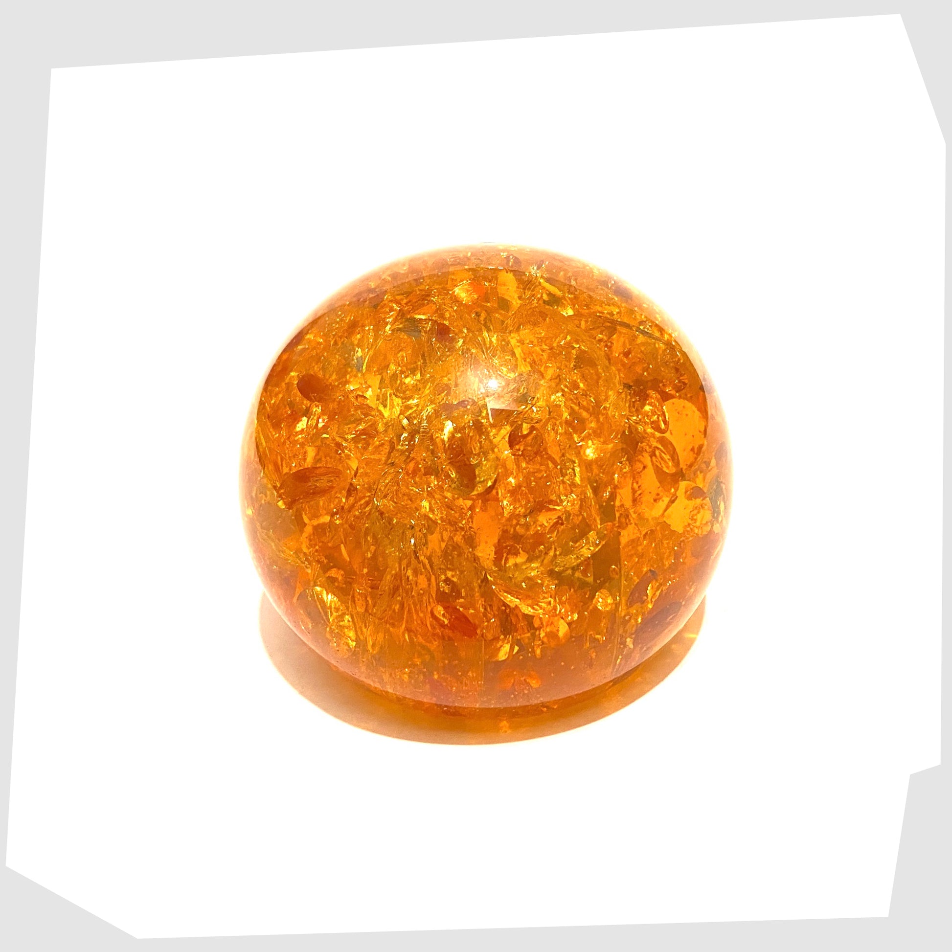 circular-shatterline-paperweight-in-orange
