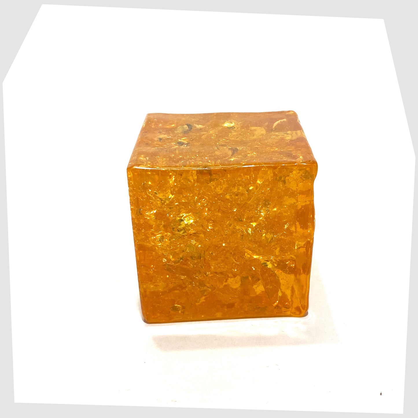 Shattaline Cube Paperweight in vibrant orange fractal resin