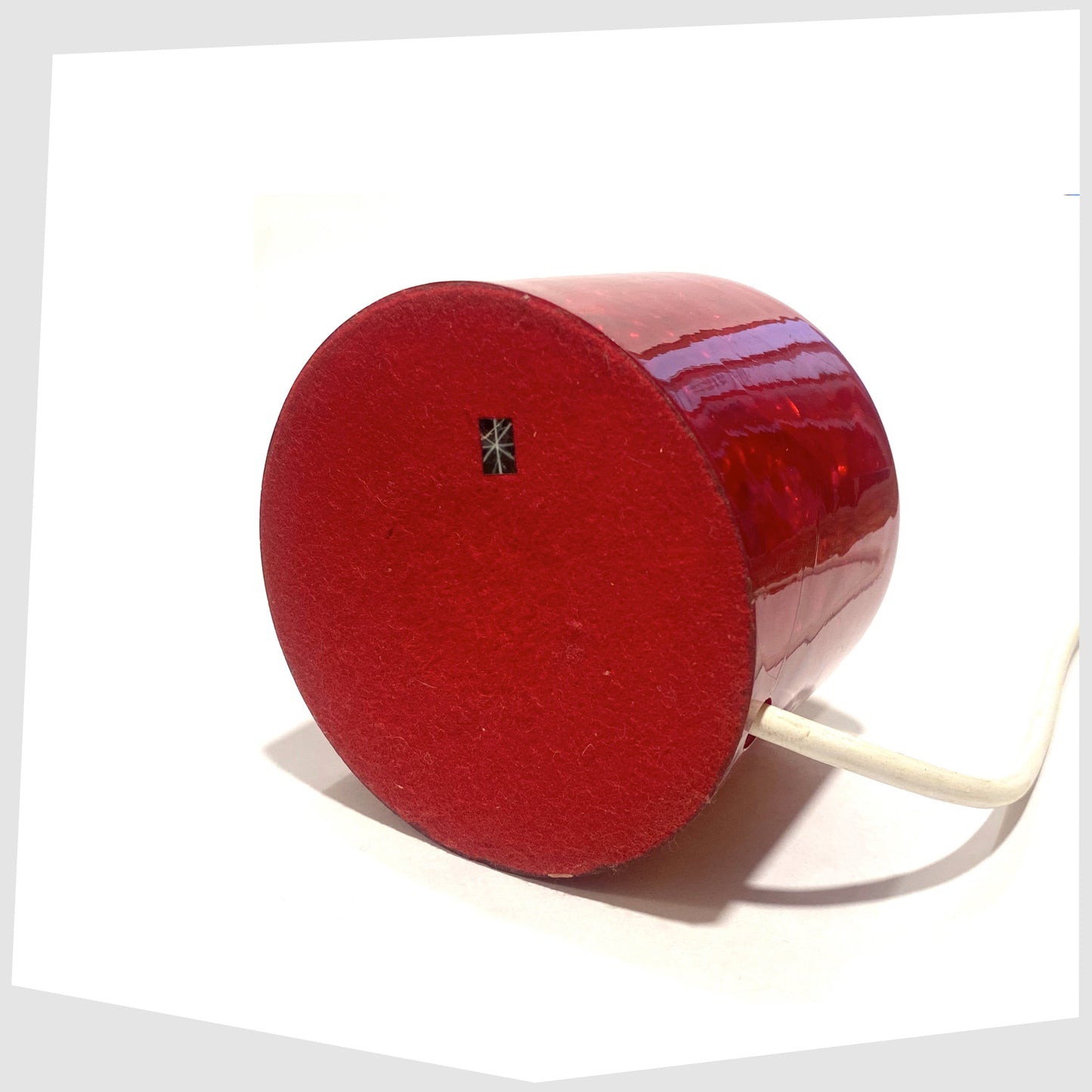 Base of the r ed Shattaline Table Lamp with a red felted base, with original black retail sticker