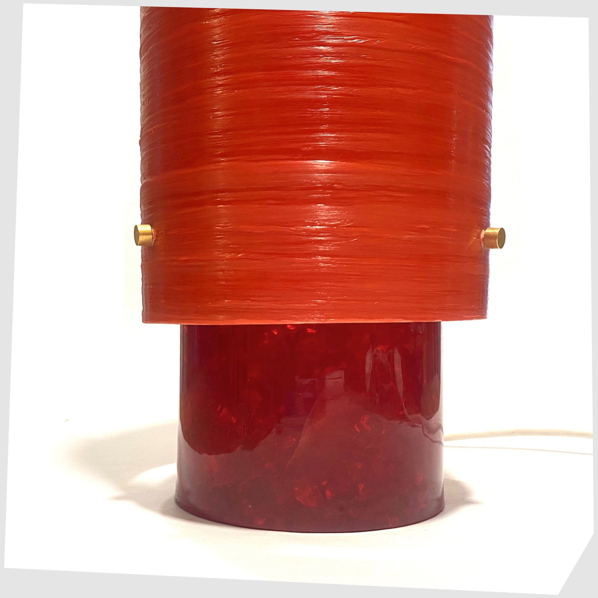 Lower section of the Red Shattaline Table Lamp with a glossy red spun fibreglass lampshade, photographed against a plain white background.