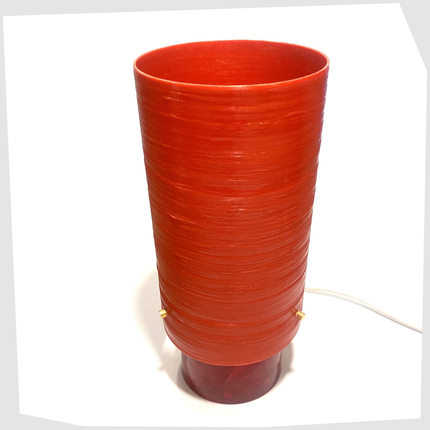 Top view of the red Shattaline Table Lamp with a glossy red spun fibreglass lampshade, photographed against a plain white background.