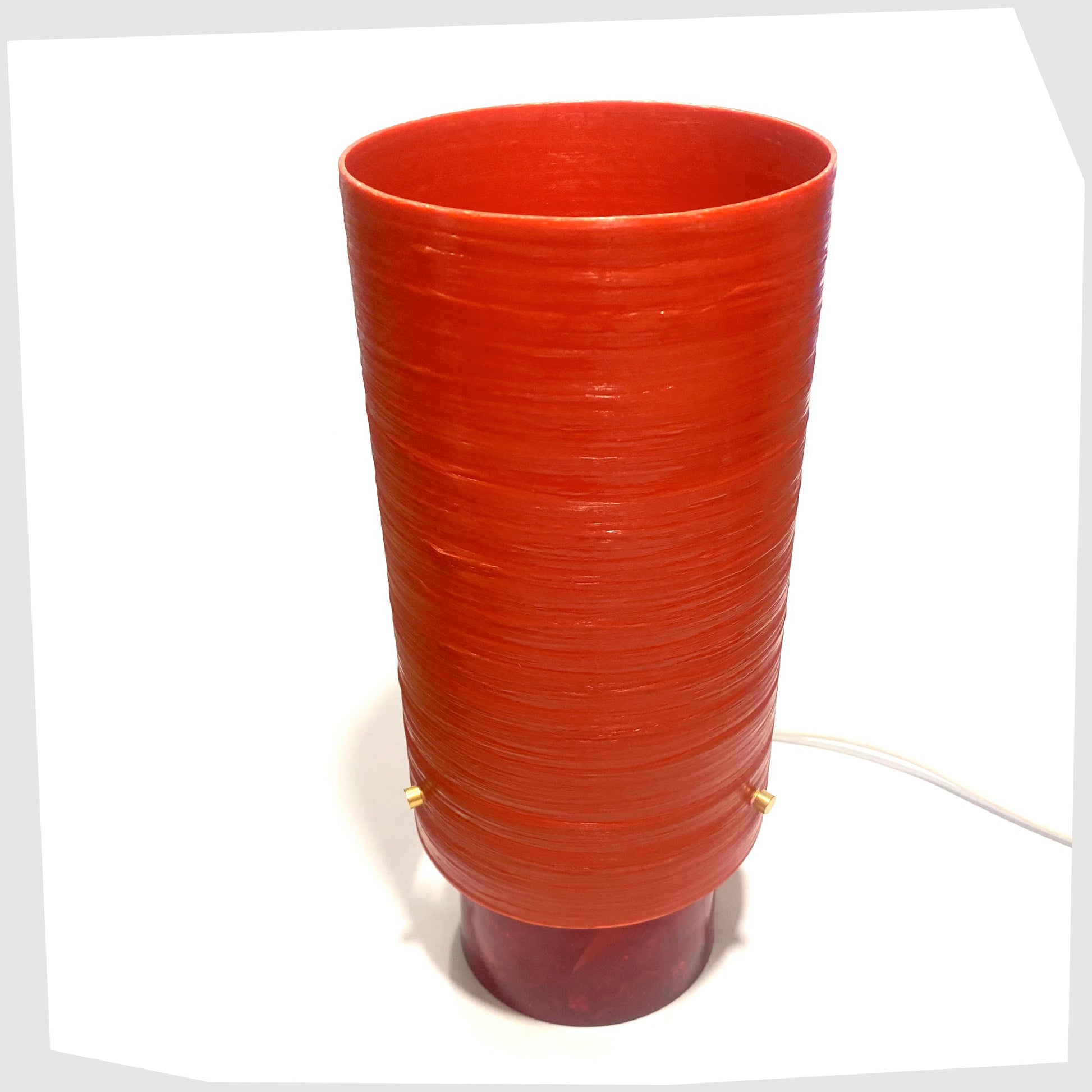 Top view of the red Shattaline Table Lamp with a glossy red spun fibreglass lampshade, photographed against a plain white background.