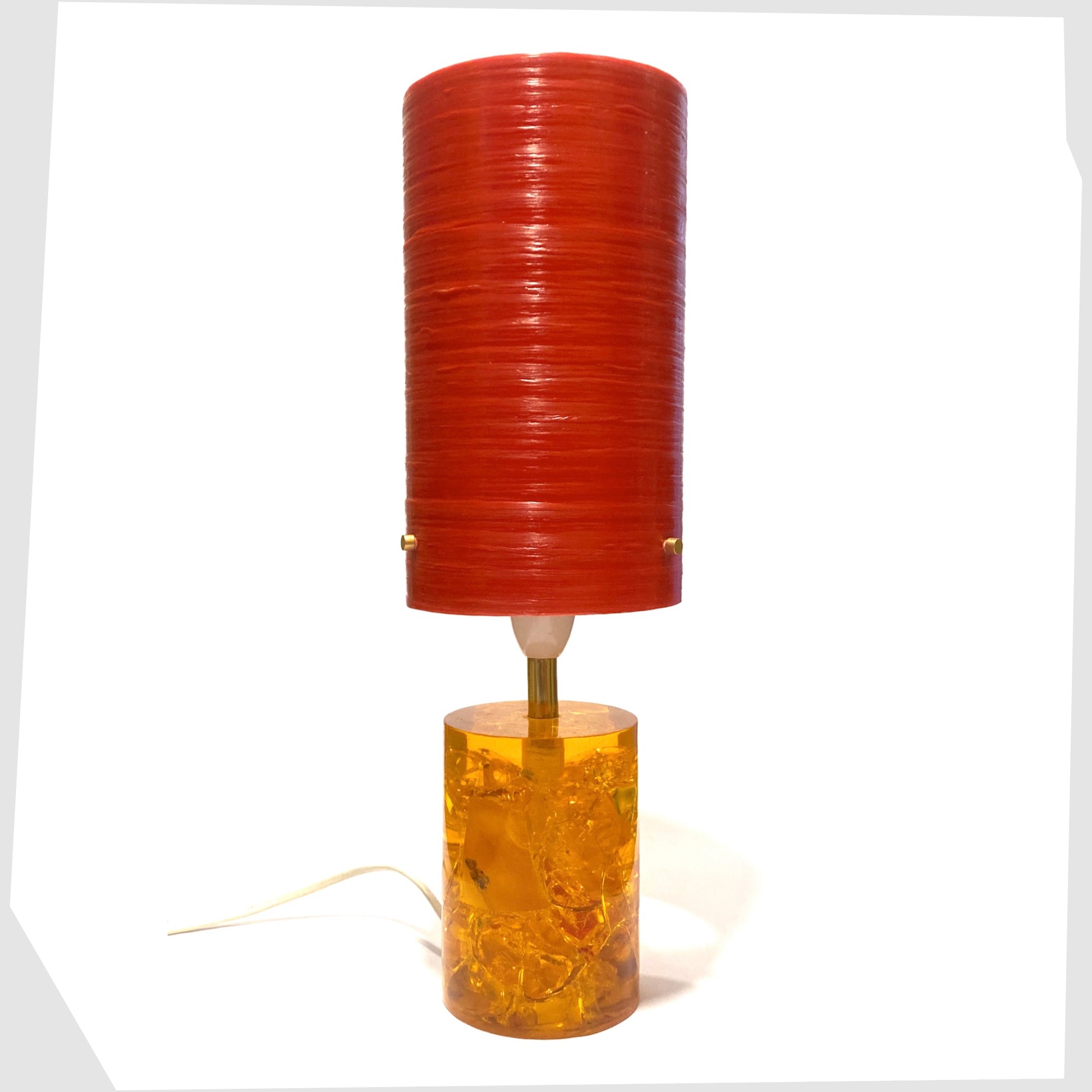 Royplast Spun Fibreglass Lamp Shade in Red by By Royale, shown on an orange Shattaline table lamp base