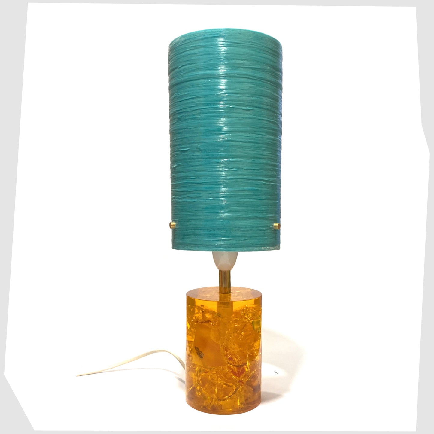 Royplast Spun Fibgreglass Lamp Shade in Turquoise by By Royale, shown on an orange Shattaline table lamp base