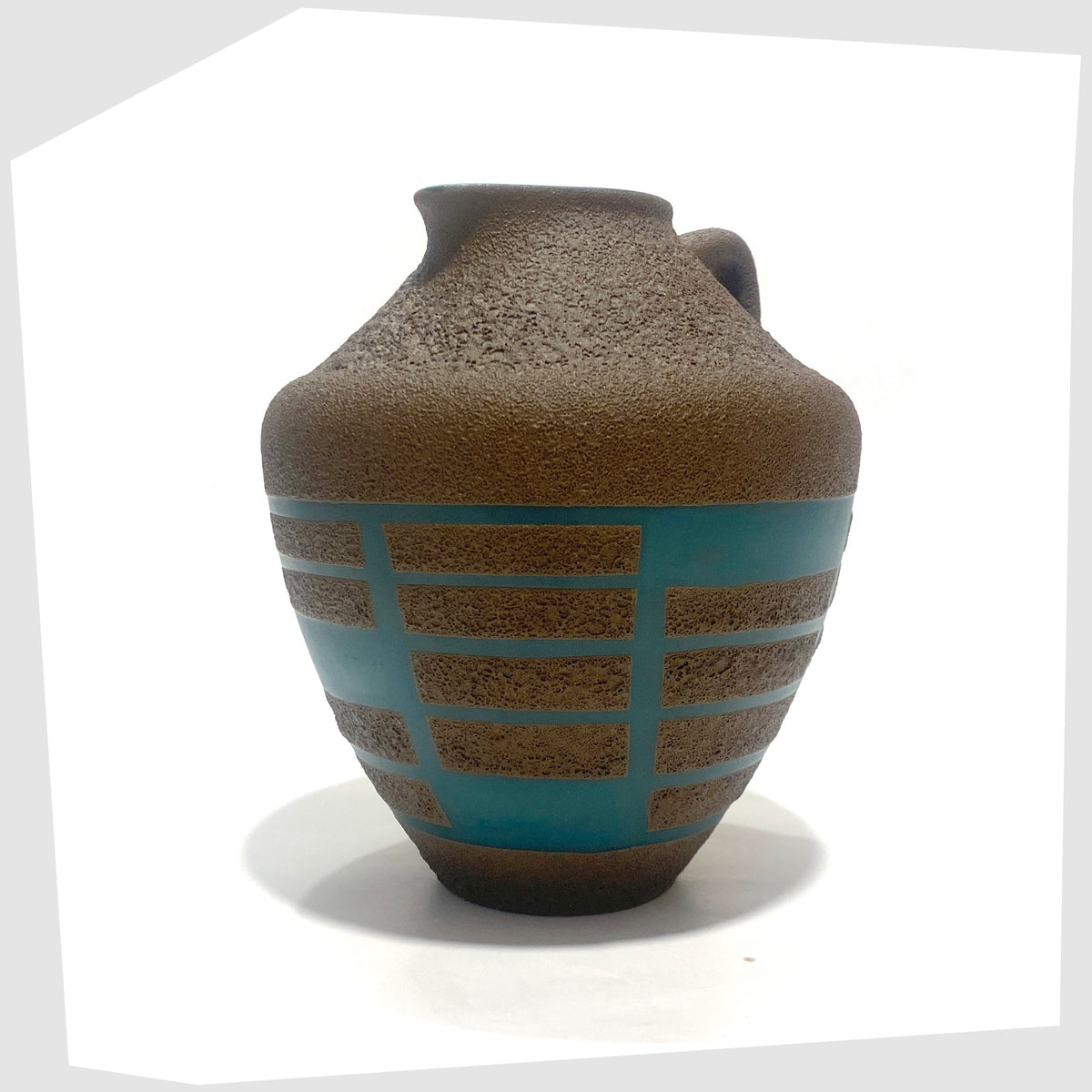 Front of the Steuler Keramik 4321/00 Vase in teal glaze with matte fat lava geometric shapes, shown on a white background