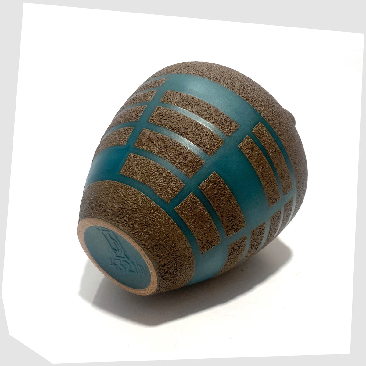 Base of the Steuler Keramik 4321/00 Vase in teal glaze with matte fat lava geometric shapes, shown on a white background