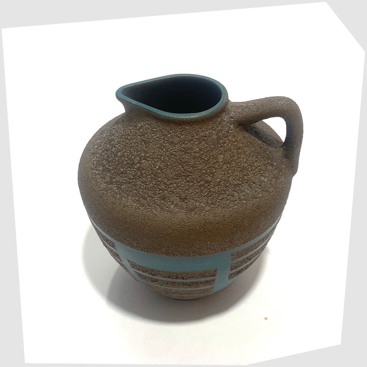 Top rim of the Steuler Keramik 4321/00 Vase in teal glaze with matte fat lava geometric shapes, shown on a white background
