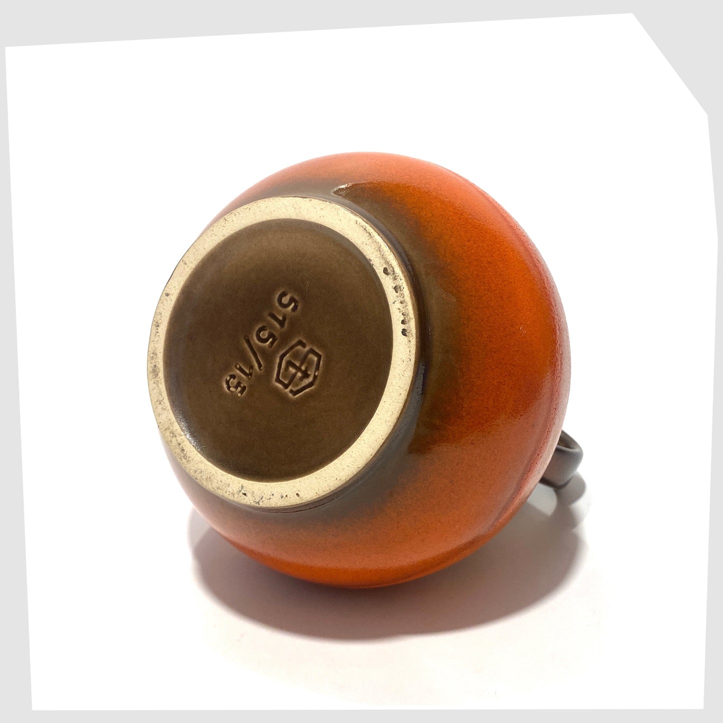 base of the Steuler Keramik 515/15 Vase in a vibrant orange fat lava glaze