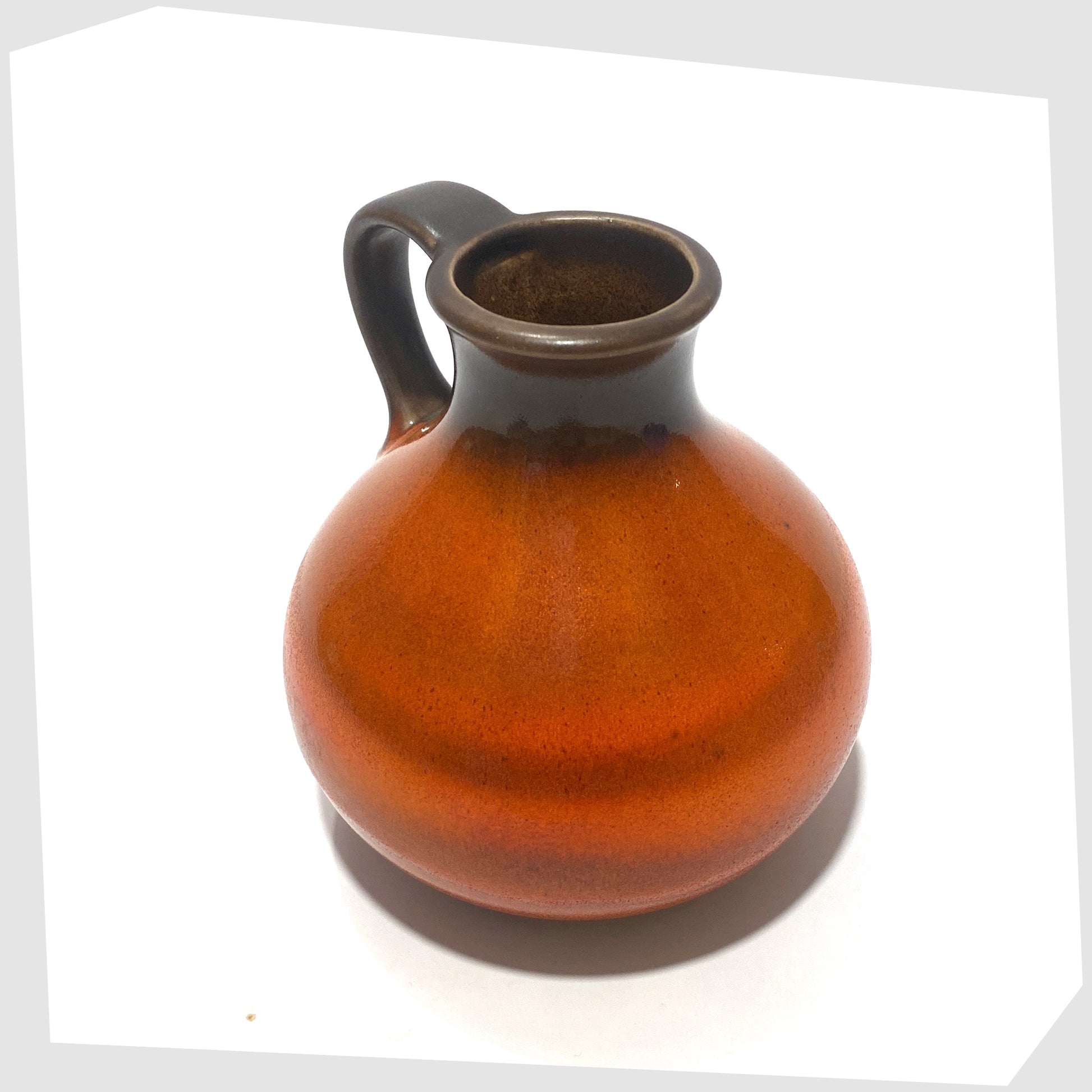 top rim of the Steuler Keramik 515/15 Vase in a vibrant orange fat lava glaze