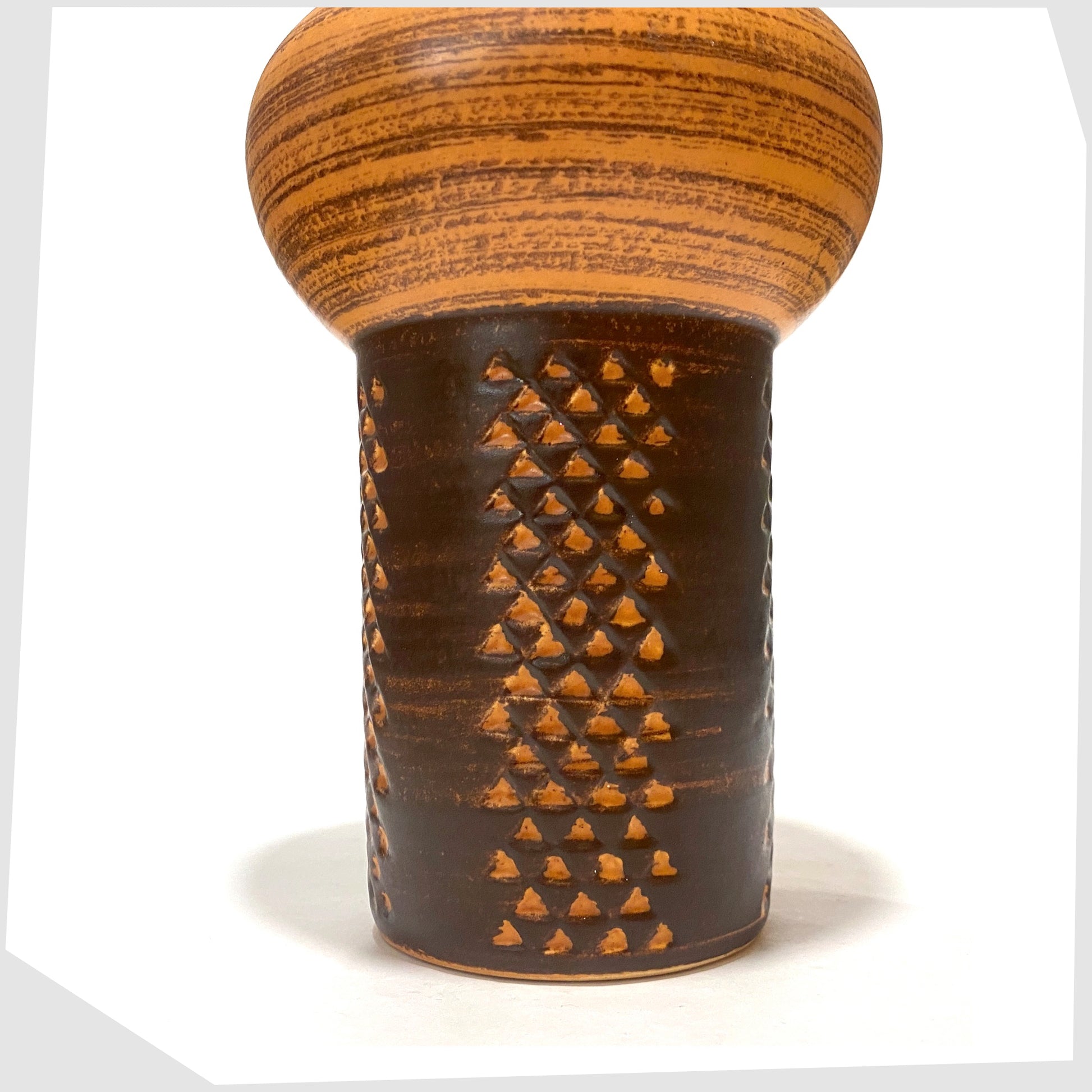 Lower section of the Strehla Keramik 1180 Vase with architectural mushroom form in burnt orange glaze with artistic geometric pattern, shown on a white background