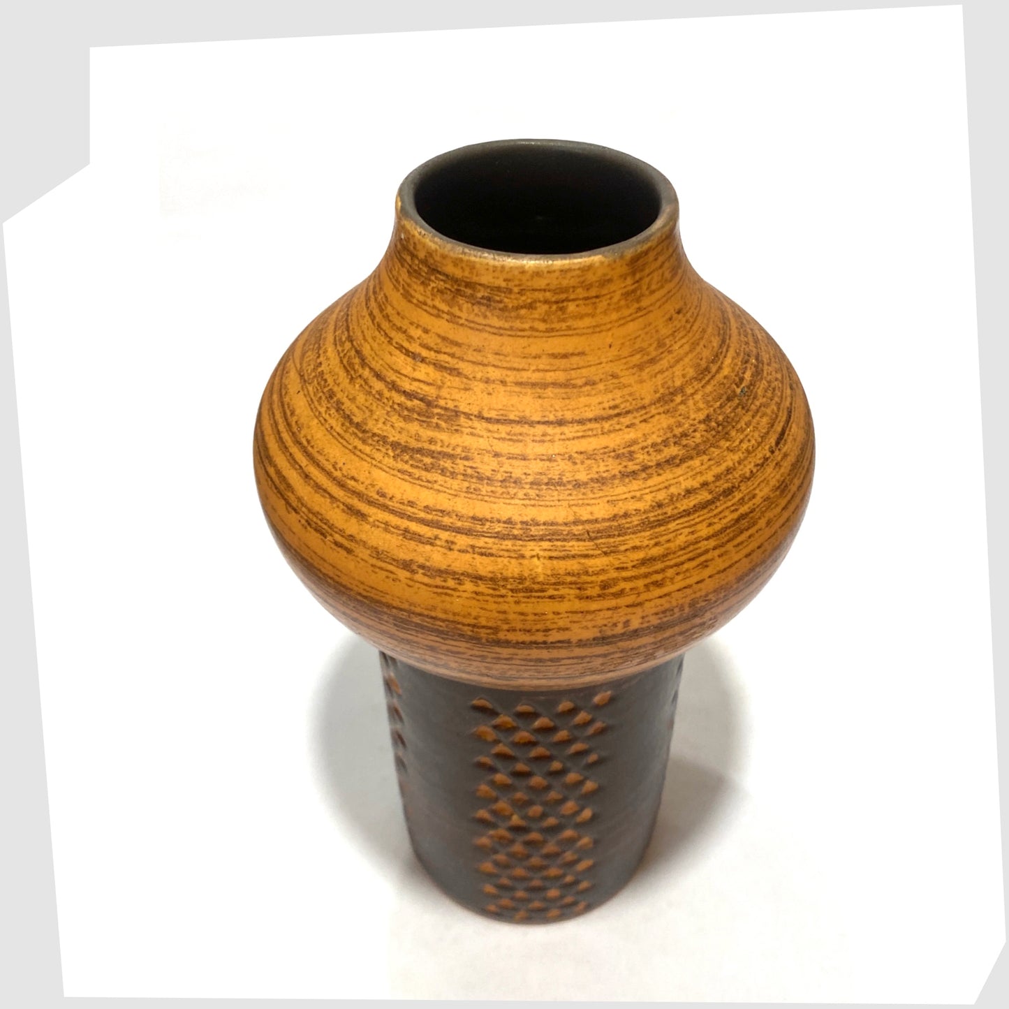 Overhead view of the Strehla Keramik 1180 Vase with architectural mushroom form in burnt orange glaze with artistic geometric pattern, shown on a white background