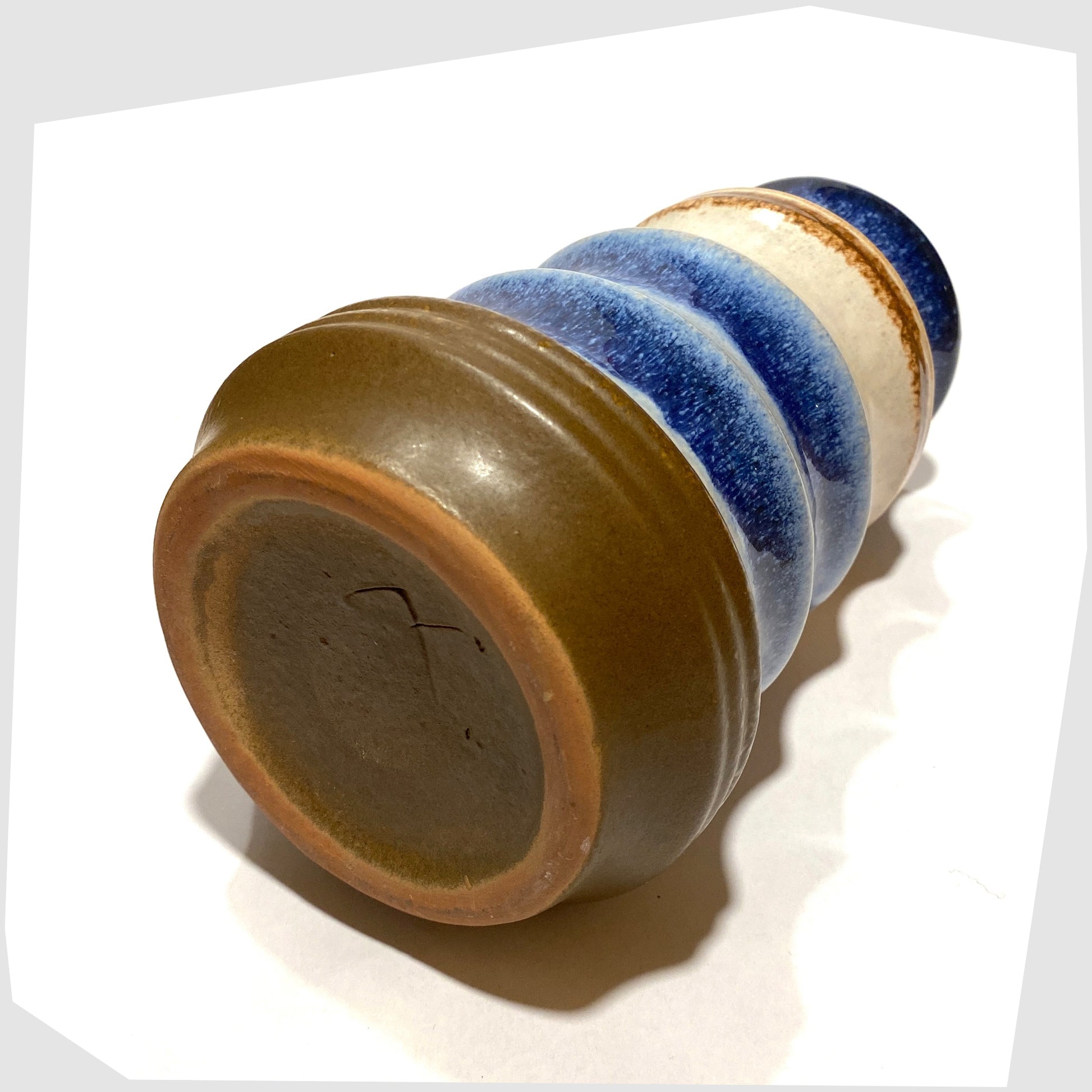 base of the vintage Strehla Keramik Pagoda Vase finished in rings of white, blue and brown glaze
