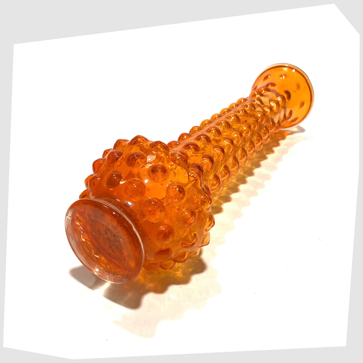 Base of the Tajima Japanese Orange Cased Glass Vase with repeating knobbly design, shown on a white background