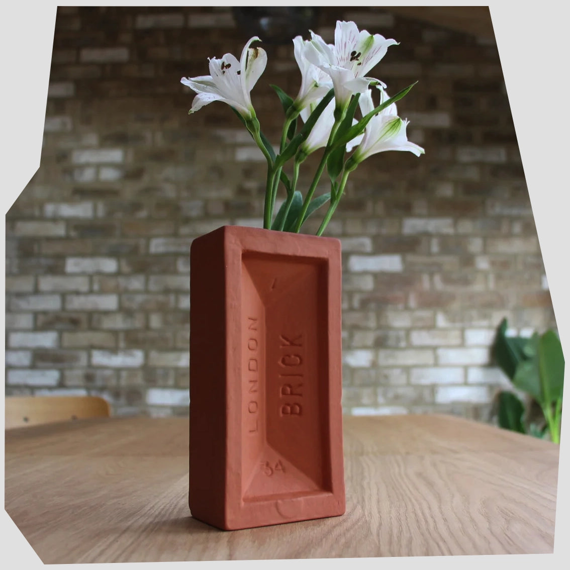 Lifestyle image of the London Brick Vase in Terracotta by Stolen Form