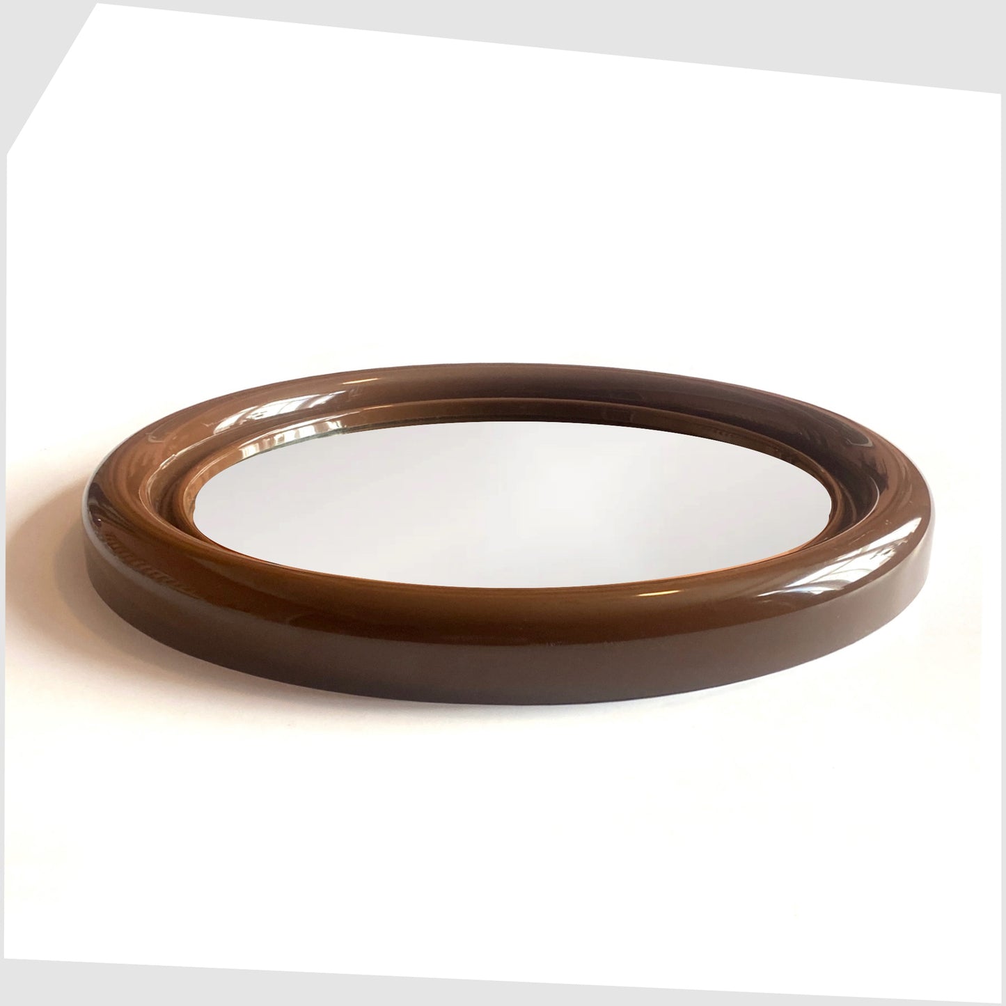 side profile of the Crayonne Circular Wall Mirror in brown colour way