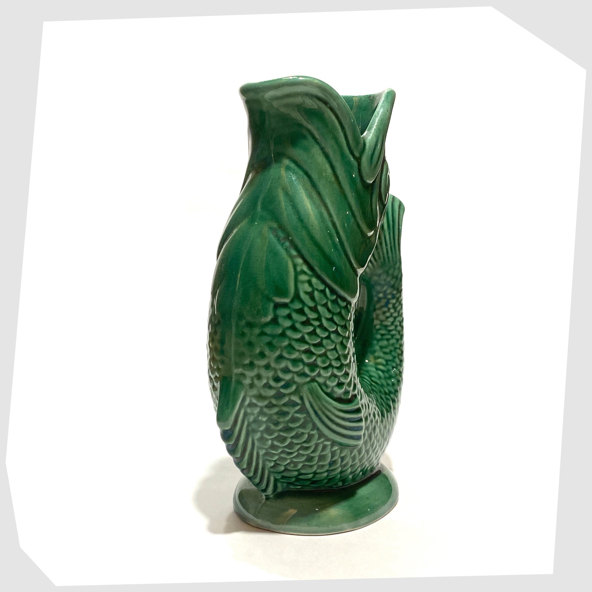 front of the Dartmouth Pottery Gluggle Jug in the iconic green colour way