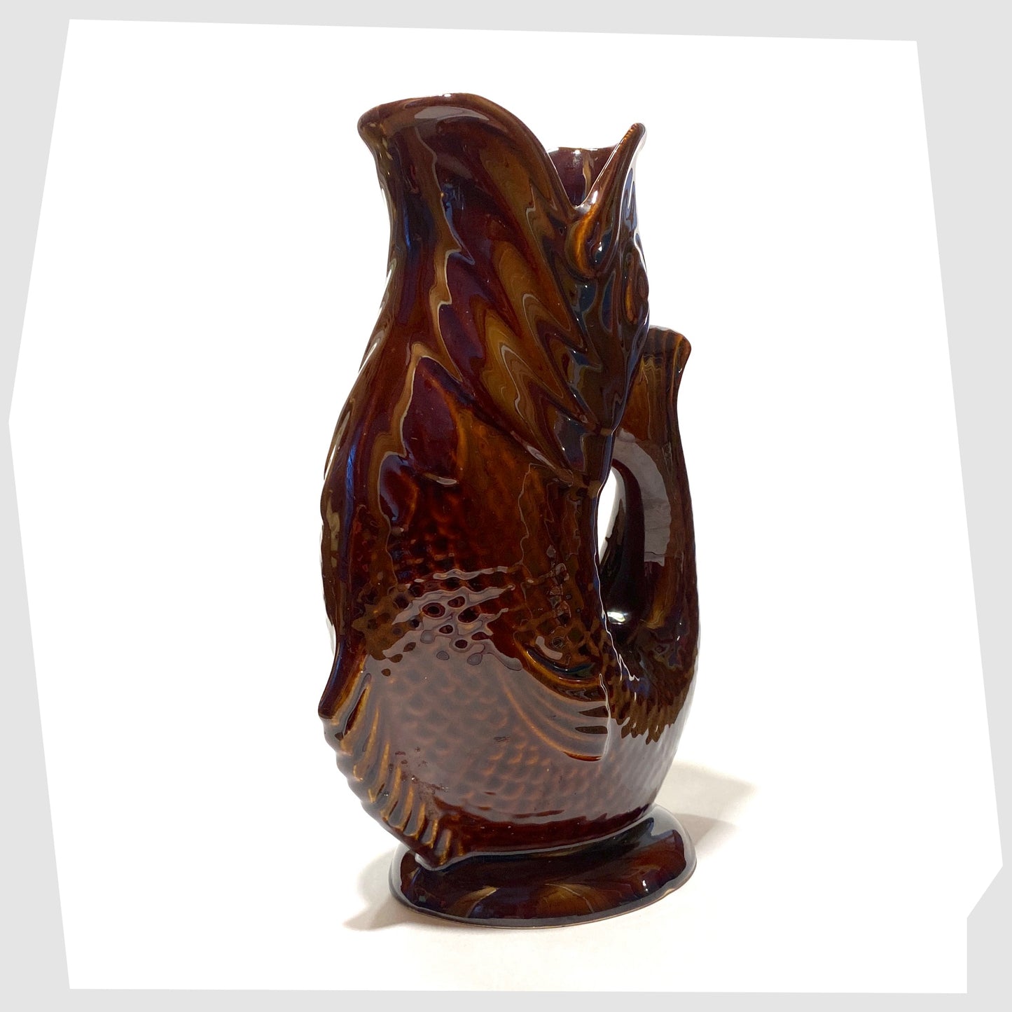 large fish shaped gluggle jug made by Dartmouth pottery, glazed in a chestnut brown colour way