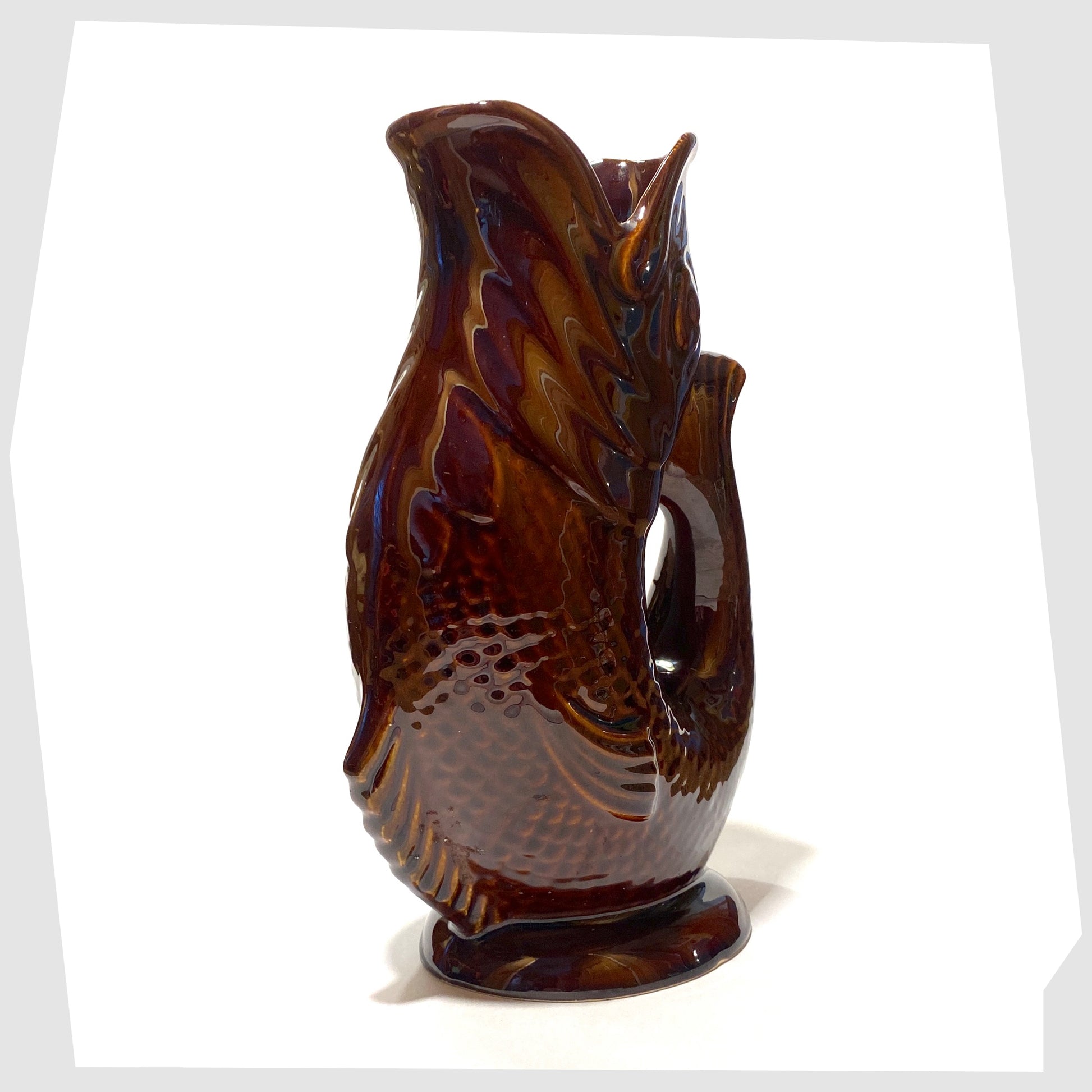 large fish shaped gluggle jug made by Dartmouth pottery, glazed in a chestnut brown colour way