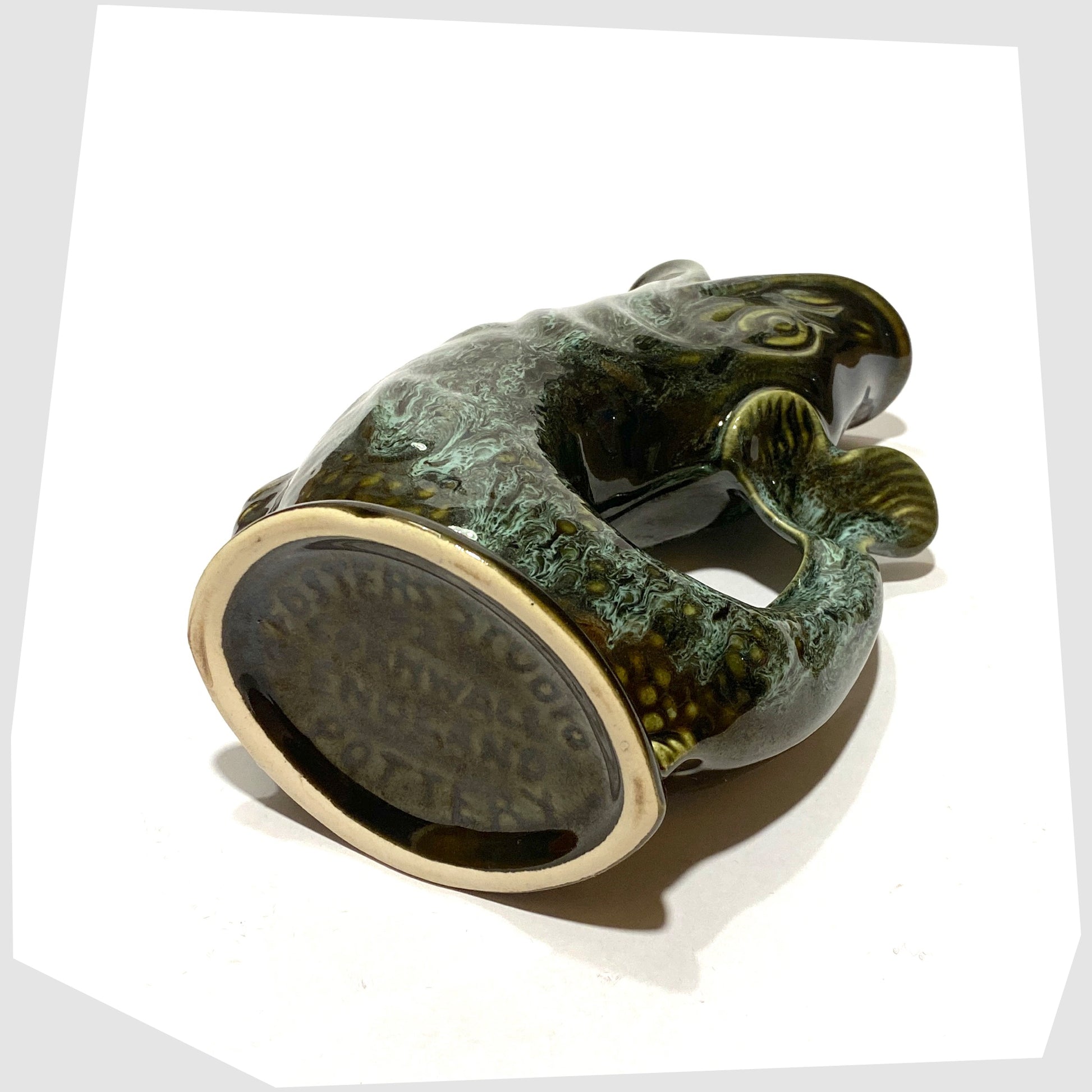 base of the vintage fosters studio pottery gluggle jug in green drip glaze